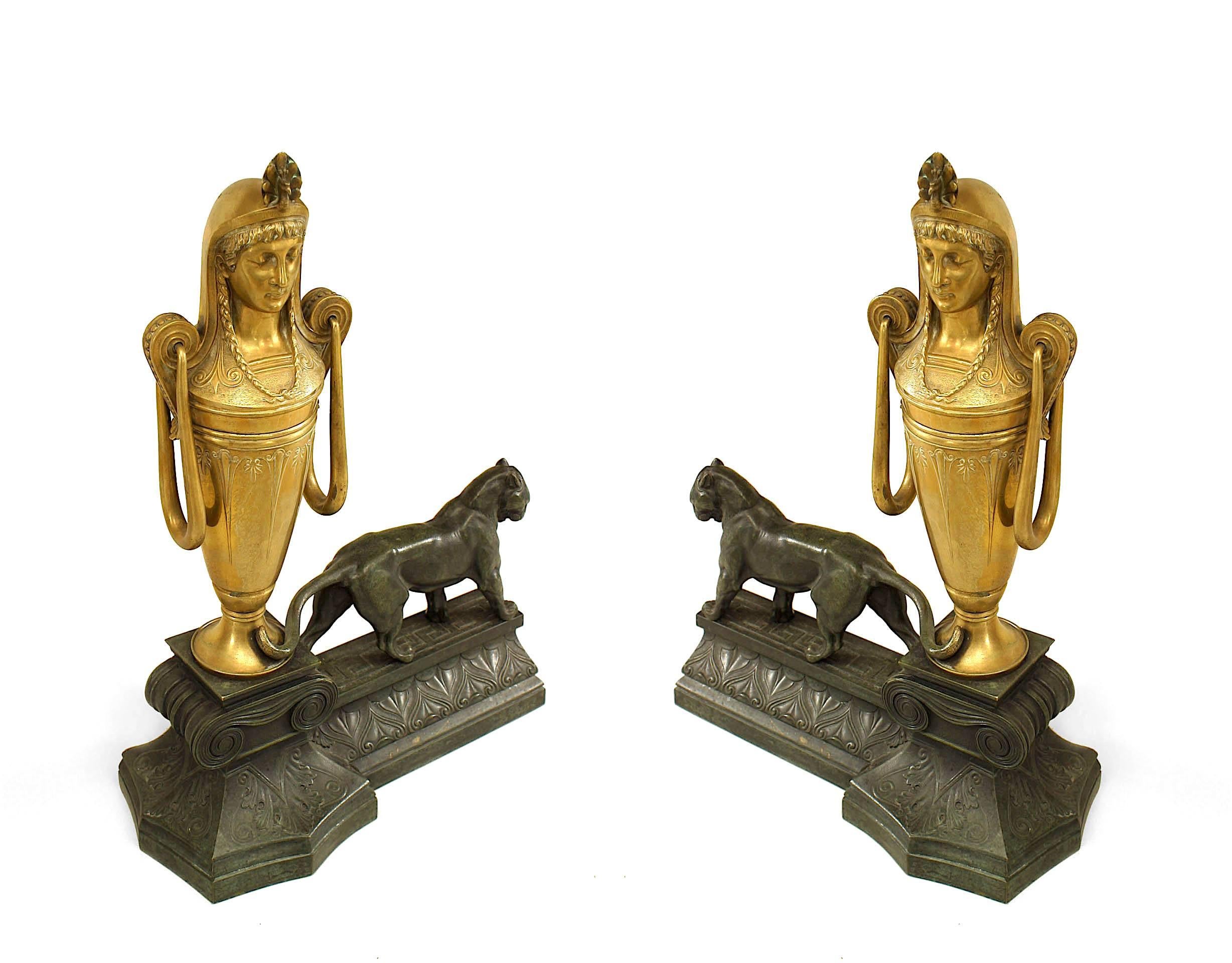 Pair of French Empire-style (Mid-19th Century) bronze andirons with a panther standing next to a gilt urn with a classical Egyptian head (PRICED AS Pair)
