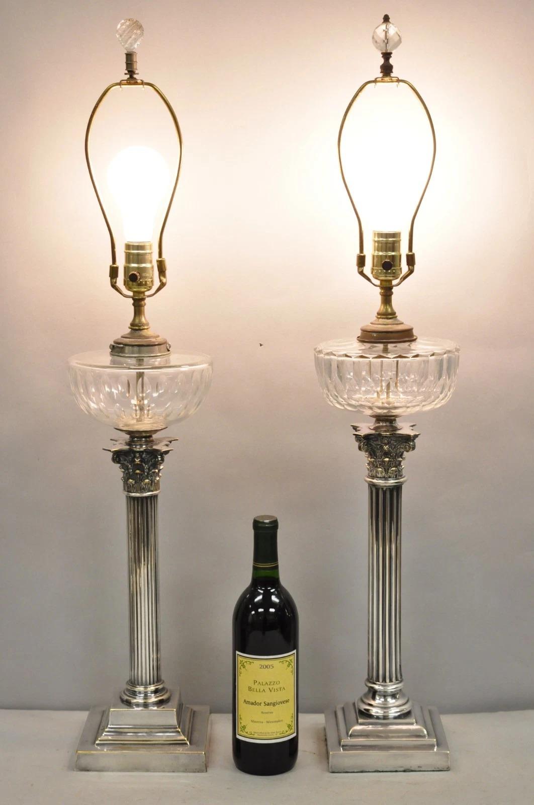 Antique French Empire Style English Silver Plated Corinthian Column Converted Glass Oil Lamp Table Lamps - Near Pair (Variation to design throughout). Circa Early 20th Century. Measurements: 33.5