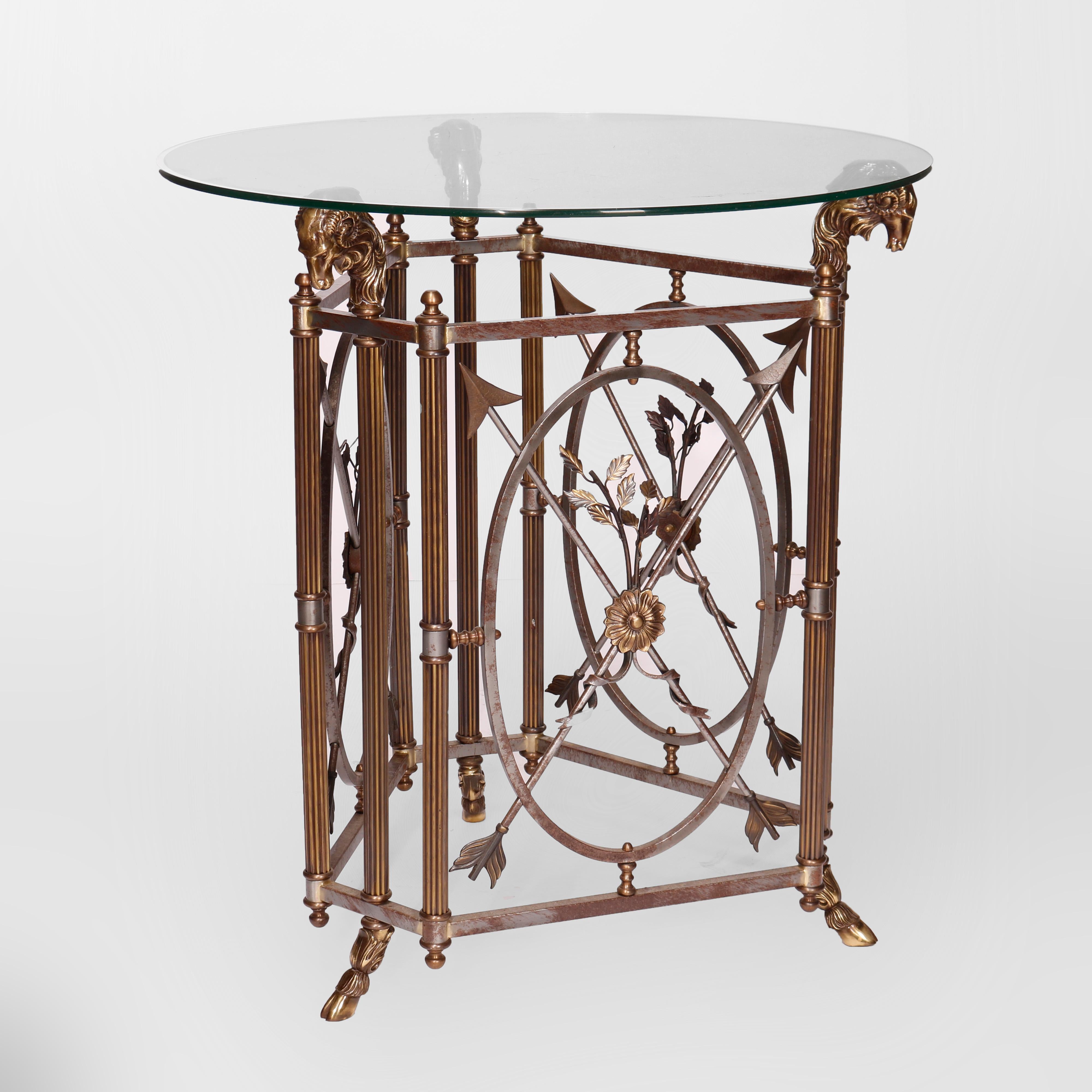 A French Empire figural center table offers glass top over cast and bronzed base in triangular form having reeded legs with rams head capitals and hoof feet, stretchers with crossed arrows, 20th century

Measures - 38.5''H X 36''W X 36''D; stand