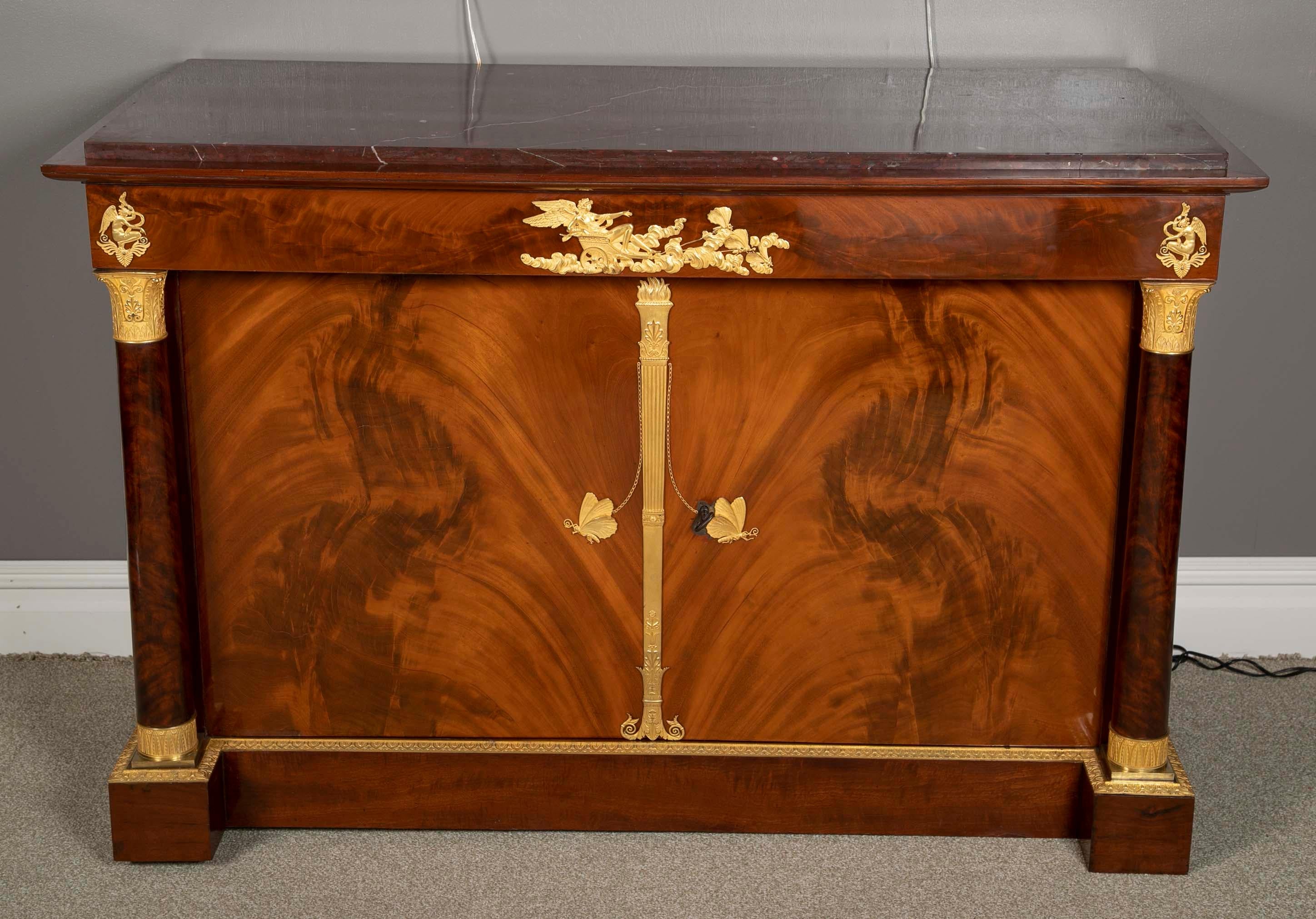 A superbly crafted French Empire commode with Rouge Griotte marble top by  Molitor.   A pair of these commodes were acquired by King Jerome between 1809 and 1812  and listed in the inventory of the city residence in 1812 of Katherina von