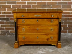 French Empire Fruitwood Four-Drawer Commode with Ebonized Corinthian Columns