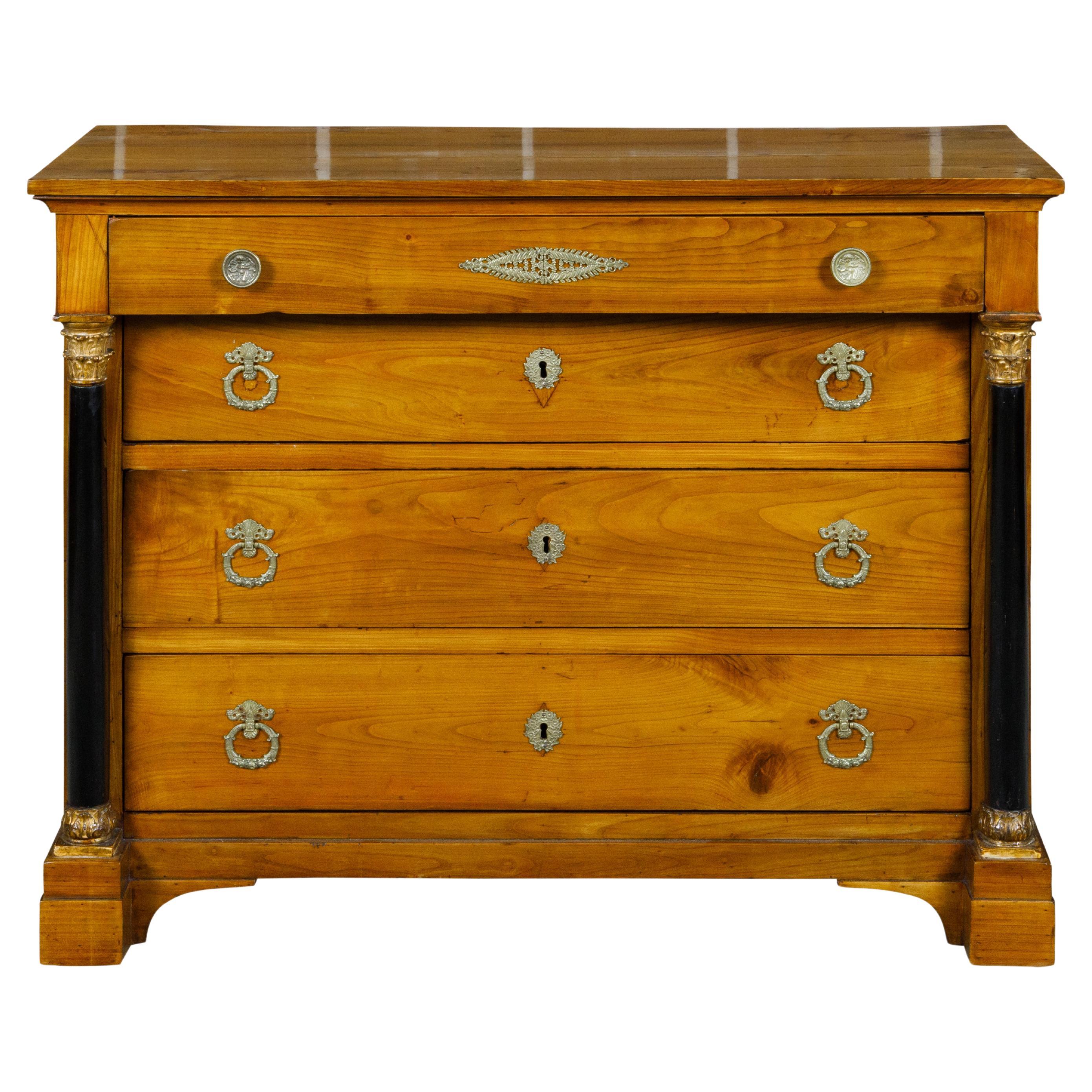 French Empire Fruitwood Four-Drawer Commode with Ebonized Corinthian Columns For Sale