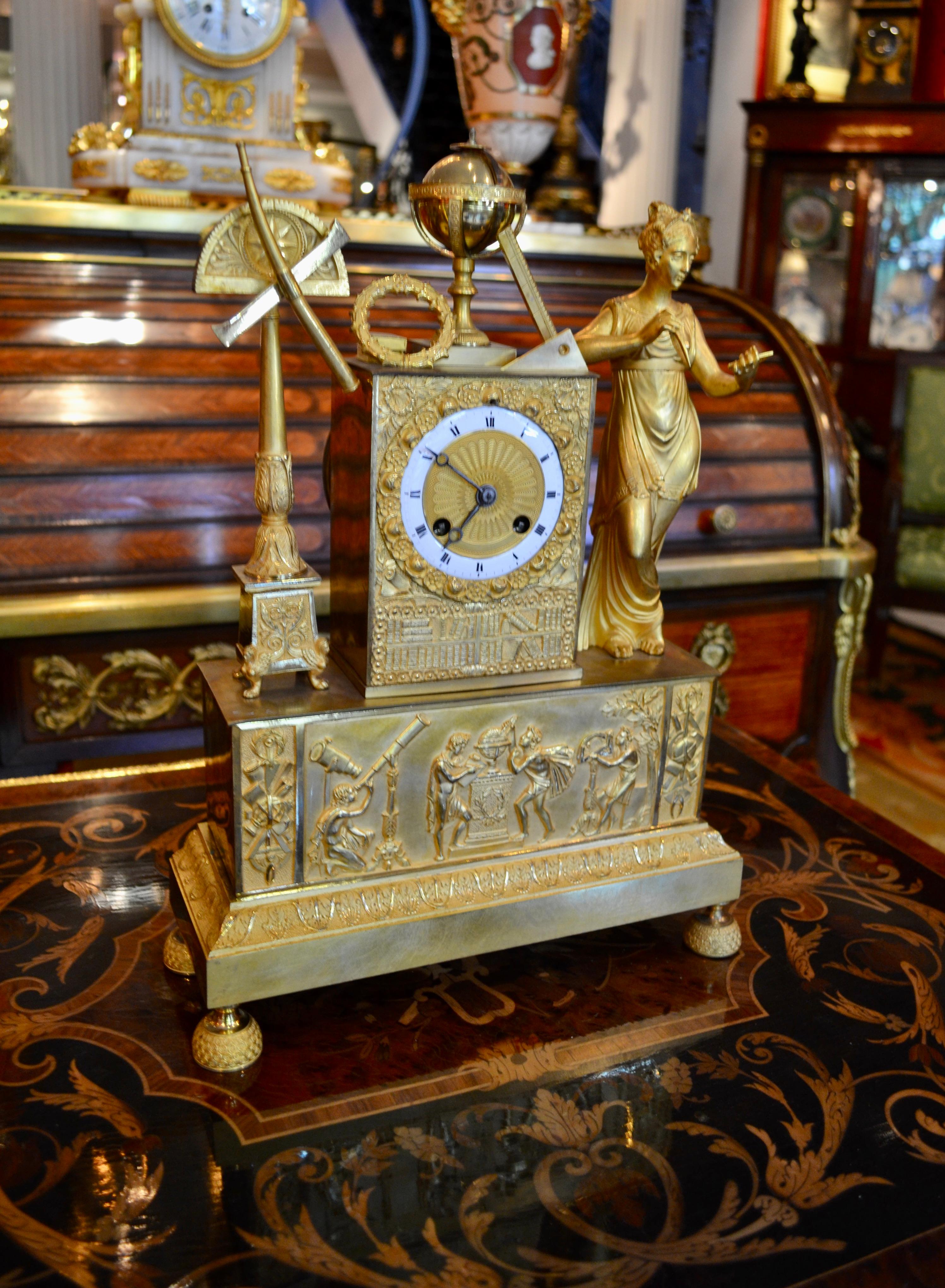 A fine example of a period French Empire mantle clock in finely chased and gilded  bronze made in France in the first quarter of the 19thC.  One of the Greek muses with a star atop her head is shown standing on the base of the clock to the right of