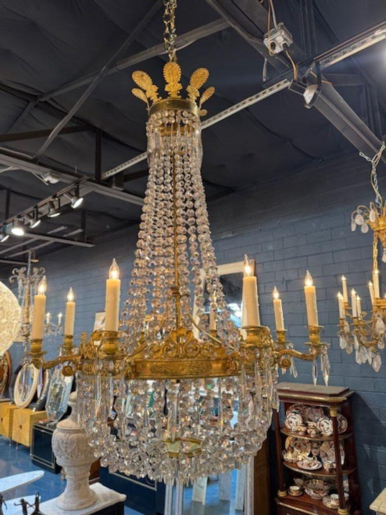 Fine 19th century French Empire gilt bronze and crystal basket chandelier. Circa 1870.  The chandelier has been professionally rewired, comes with matching chain and canopy. It is ready to hang! 32w x 35h