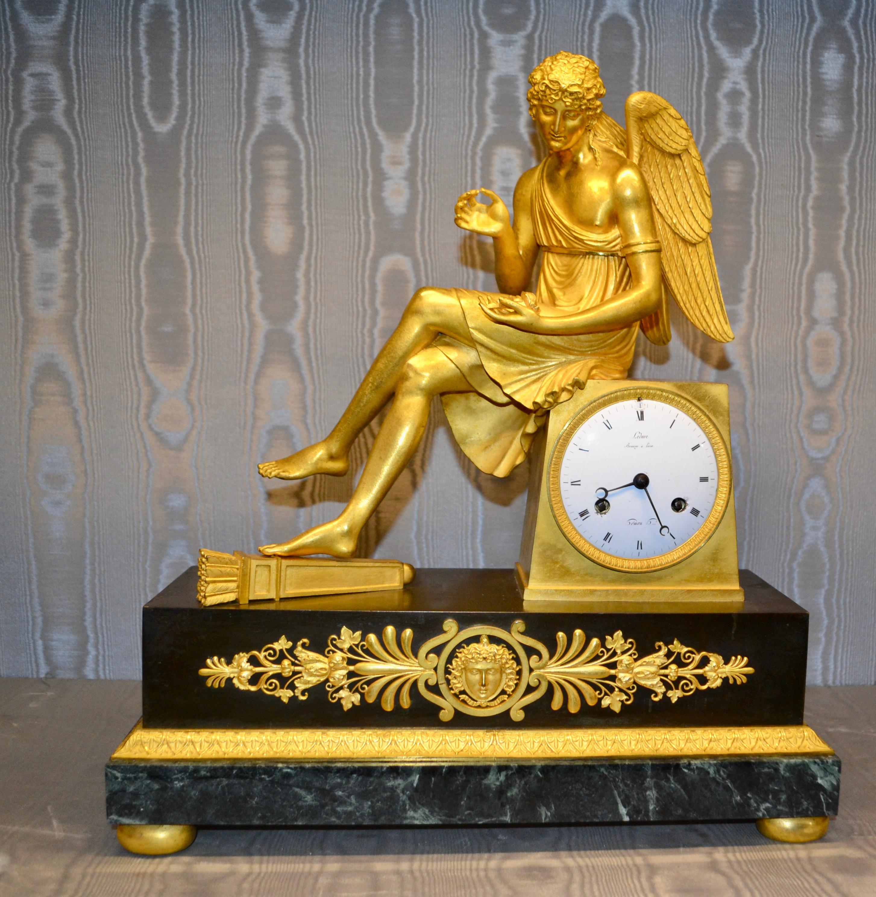 French Empire Gilt Bronze and Marble Clock of Seated Cupid Holding a Rose For Sale 6