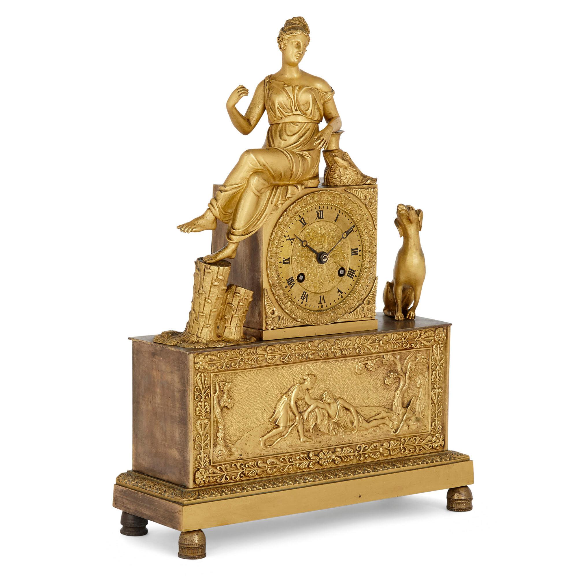 French Empire gilt bronze clock
French, early 19th century
Measures: Height 38cm, width 27cm, depth 10cm

This fine gilt bronze mantel clock is an excellent example of the manner and style of clock that predominated during the Empire