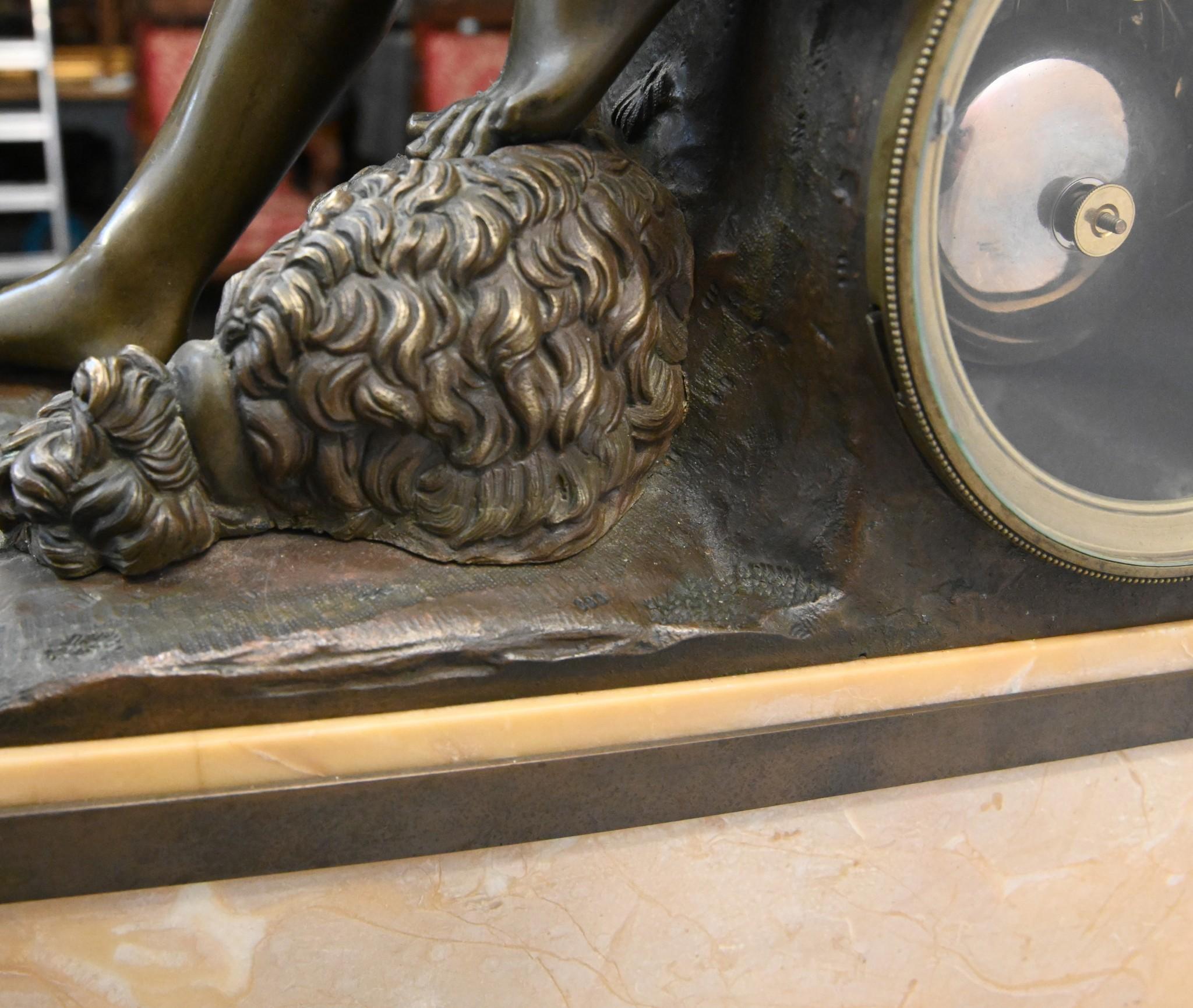 You are viewing a wonderful monumental bronze and gilt mantle clock
Circa 1820 with a silk suspension movement -  this is when the pendulum is suspended from a silk thread which in turn is connected to a small adjustment wheel
Features a semi-nude