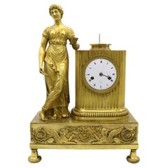 Pendule de cheminée Empire français en bronze doré, France 1810