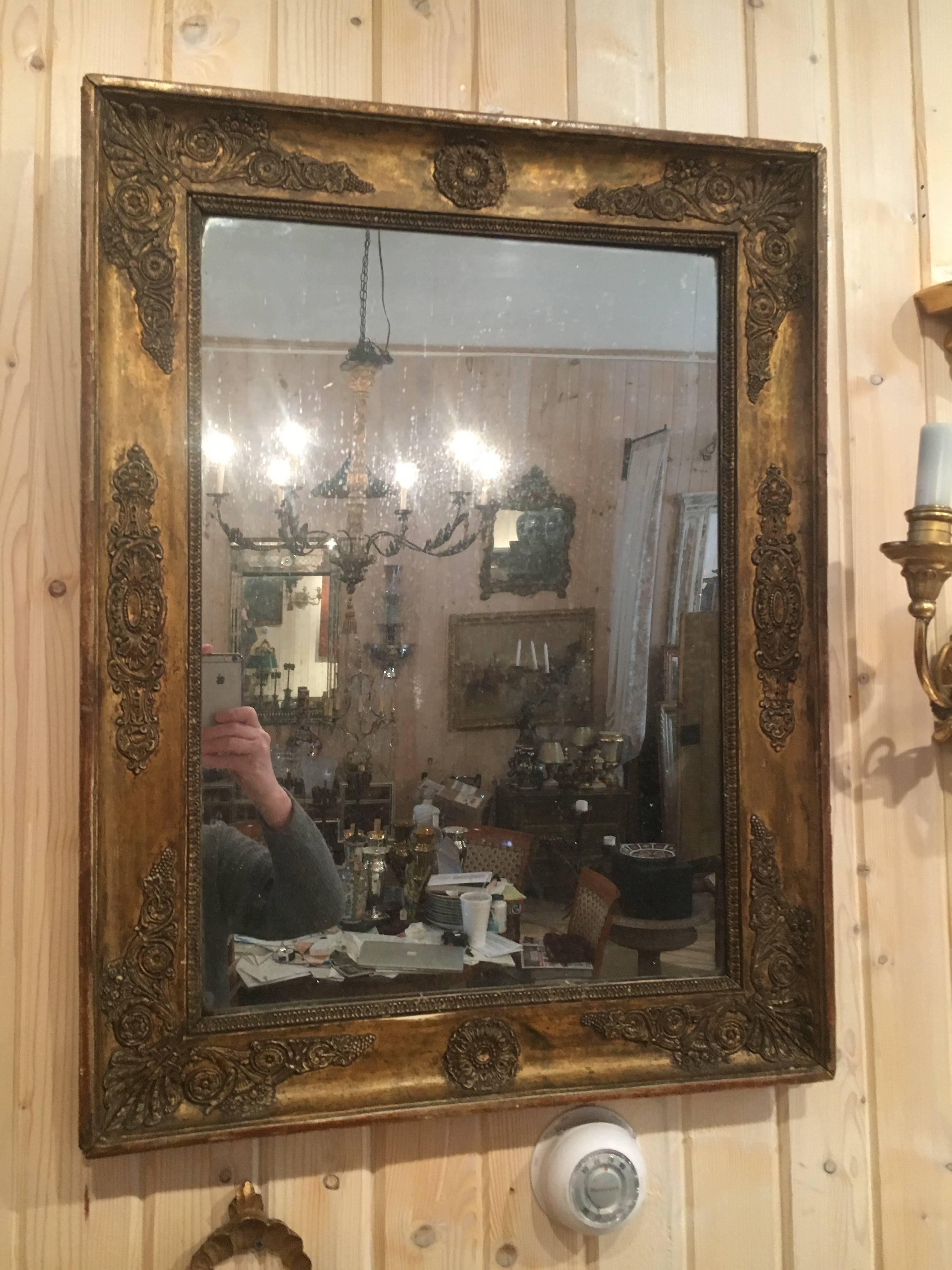 Handsome French Empire giltwood mirror with original plate.