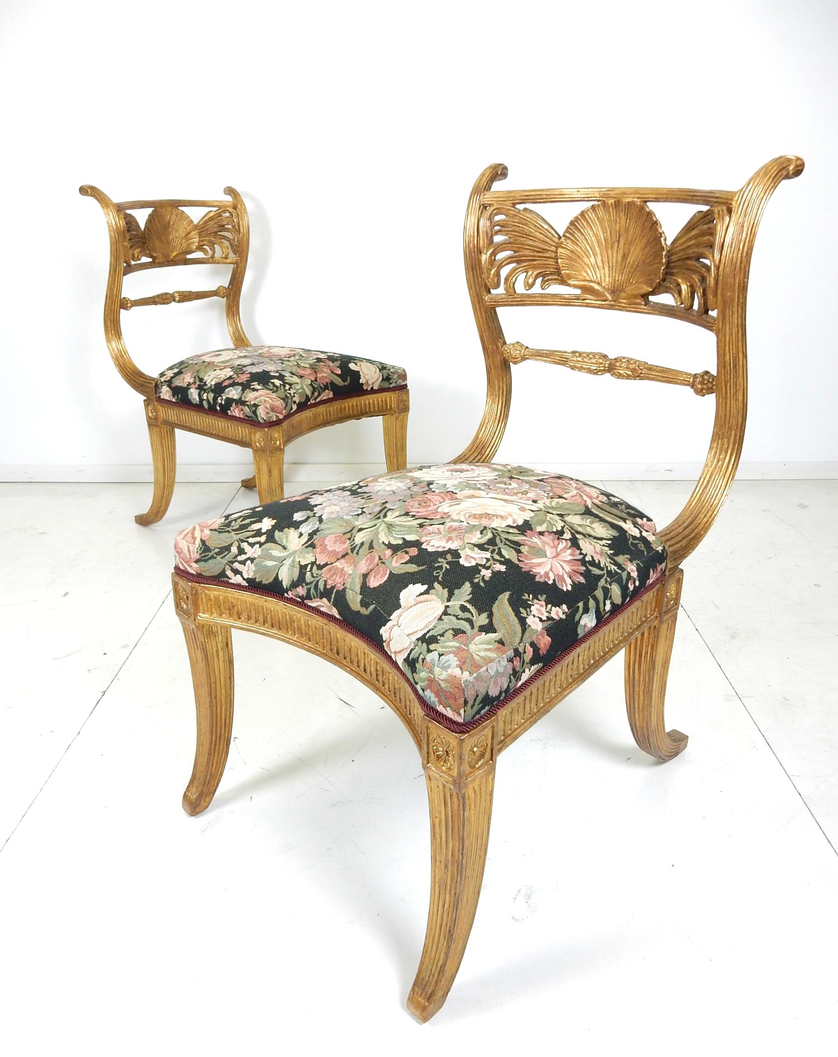 Phenomenal pair of elegant Klismos chairs from France, circa 1930s.
Antique gold gilded finish with magnificent rose garden upholstery.
Large size and very comfortable.
These chairs are in exceptional original condition. Solid with no damage or