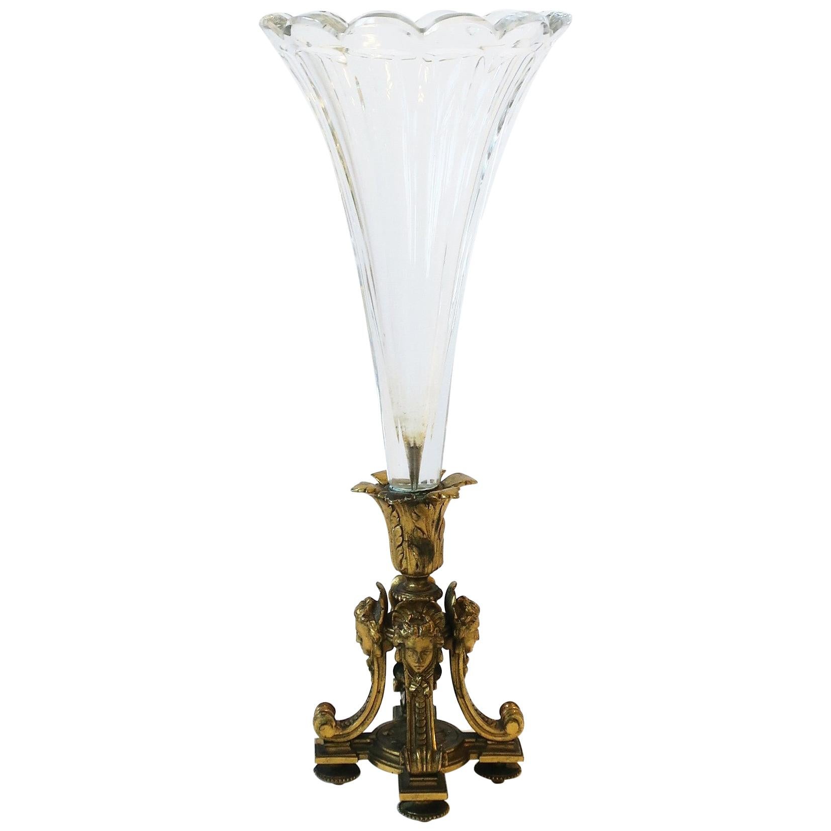 A very beautiful and substantial French Empire gold gilt bronze and crystal vase, circa late 19th century, France. Both crystal and gilt bronze are substantial; crystal has a beautiful scalloped edge and gilt bronze base extremely detailed.
