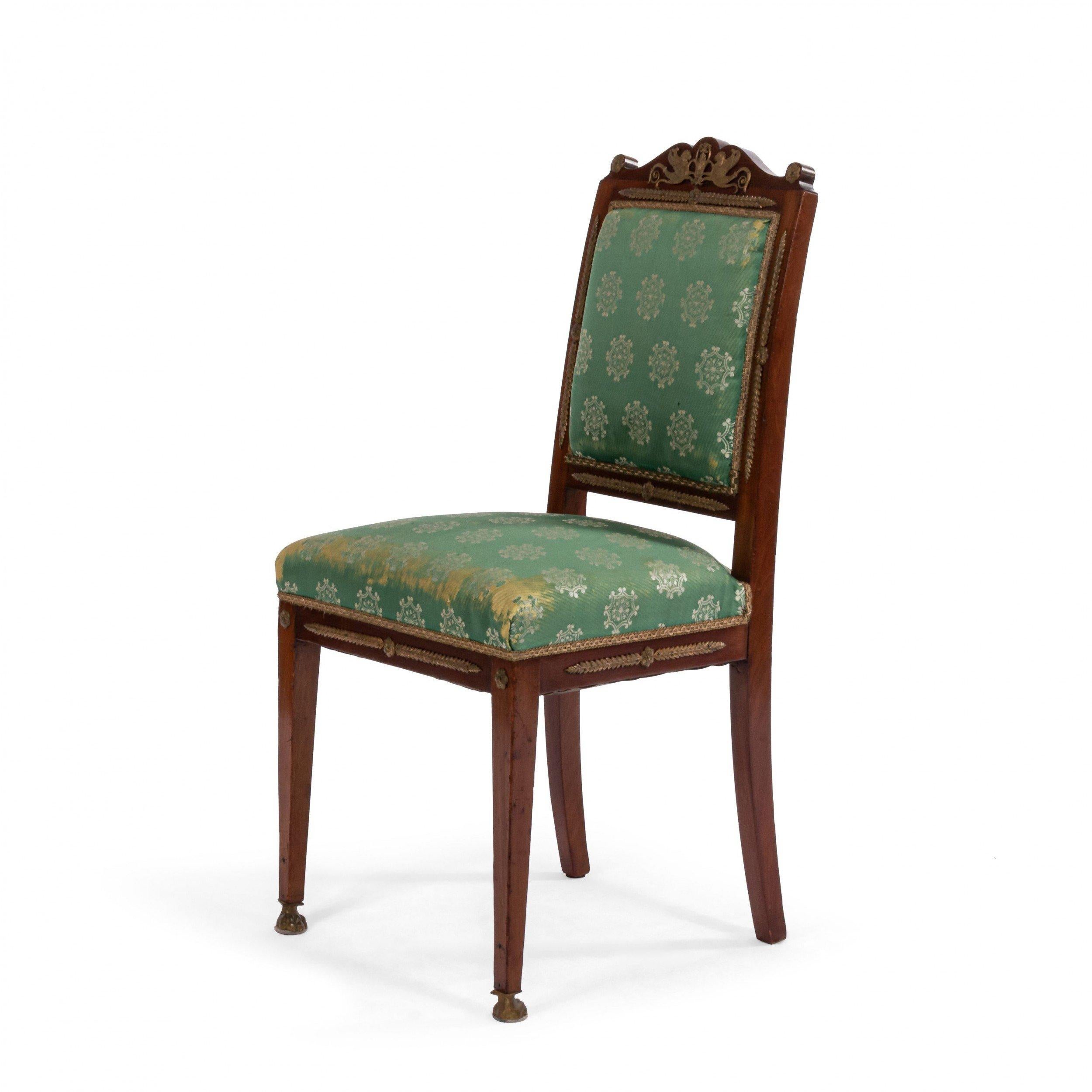 Set of 8 French Empire style (19th century) mahogany side chairs with bronze trim and green damask upholstery.