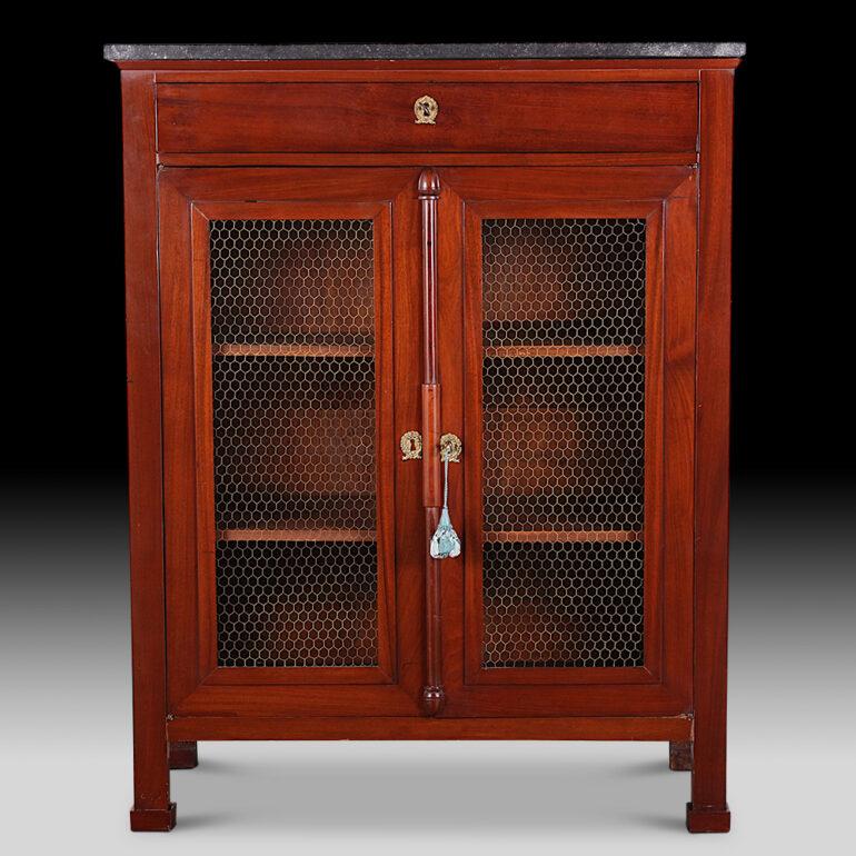 French Empire two-door cabinet in mahogany, the two doors with mesh panels and with an upper drawer above the doors. Original marble top. A useful-sized storage solution in almost any room. C. 1870