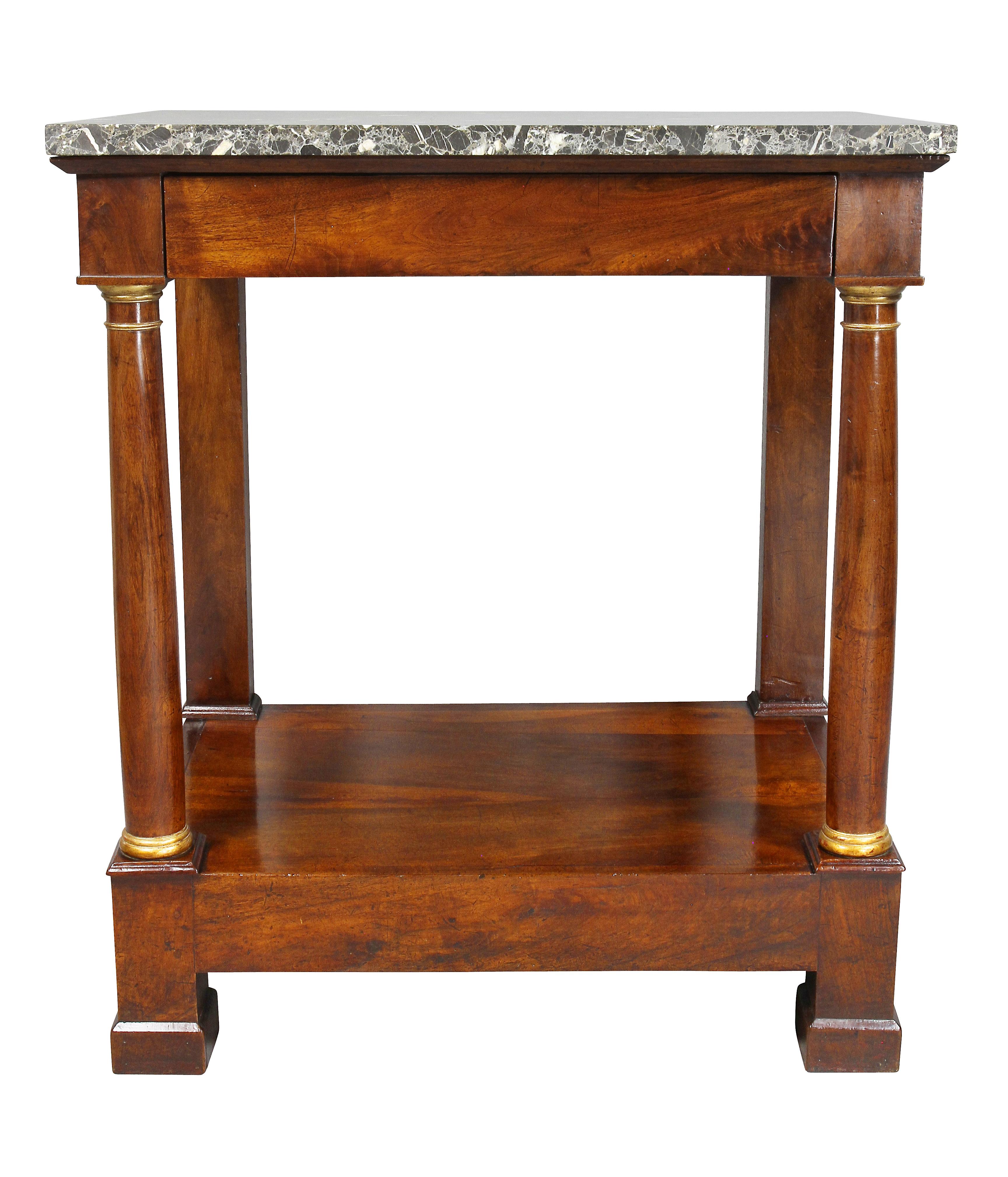 Rectangular original marble top over a frieze with drawer, all supported by parcel gilt columns joining a shelf, block feet.