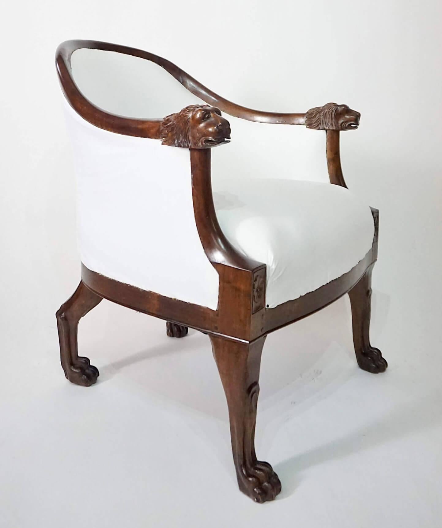 A rare and important circa 1805 'Egyptian-style' bergère believed to be an early work of famed French Empire furniture-maker François-Honoré-Georges Jacob-Desmalter of 'tub-chair' form having upholstered solid mahogany frame, the semicircular back