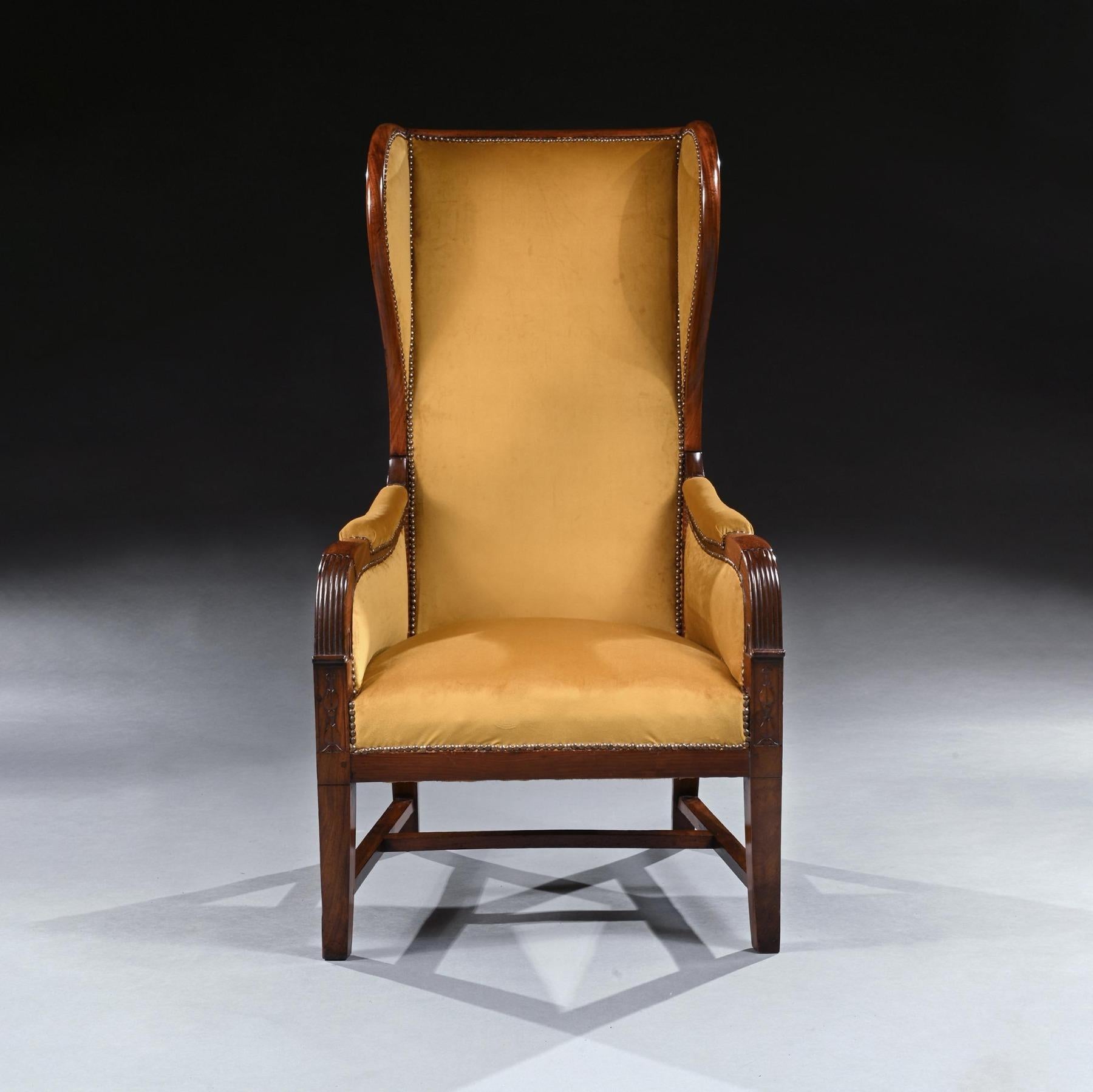An unusual French Empire mahogany reclining wing back armchair of high proportions.

French, Circa 1820.

Of elegant proportions, having an unusually high reclining winged mahogany back. The stuff-over seat between padded armrest with reeding