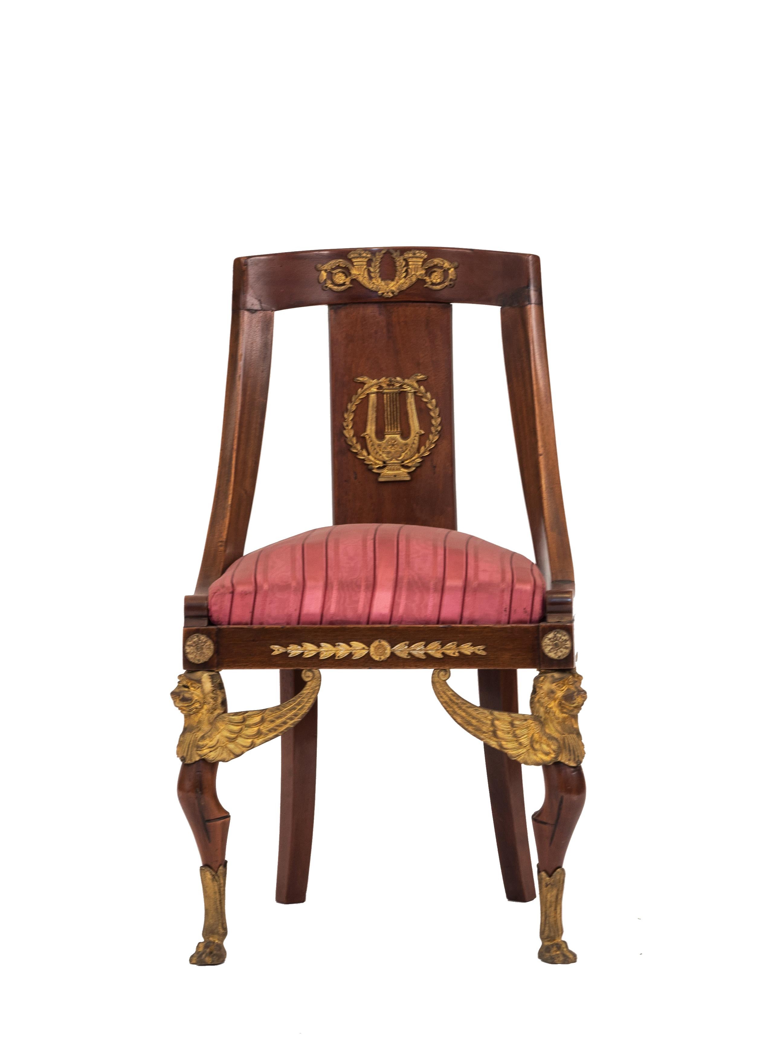 French Empire style (19th Cent) mahogany sleigh back side chair with bronze griffin legs and trim and red seat
