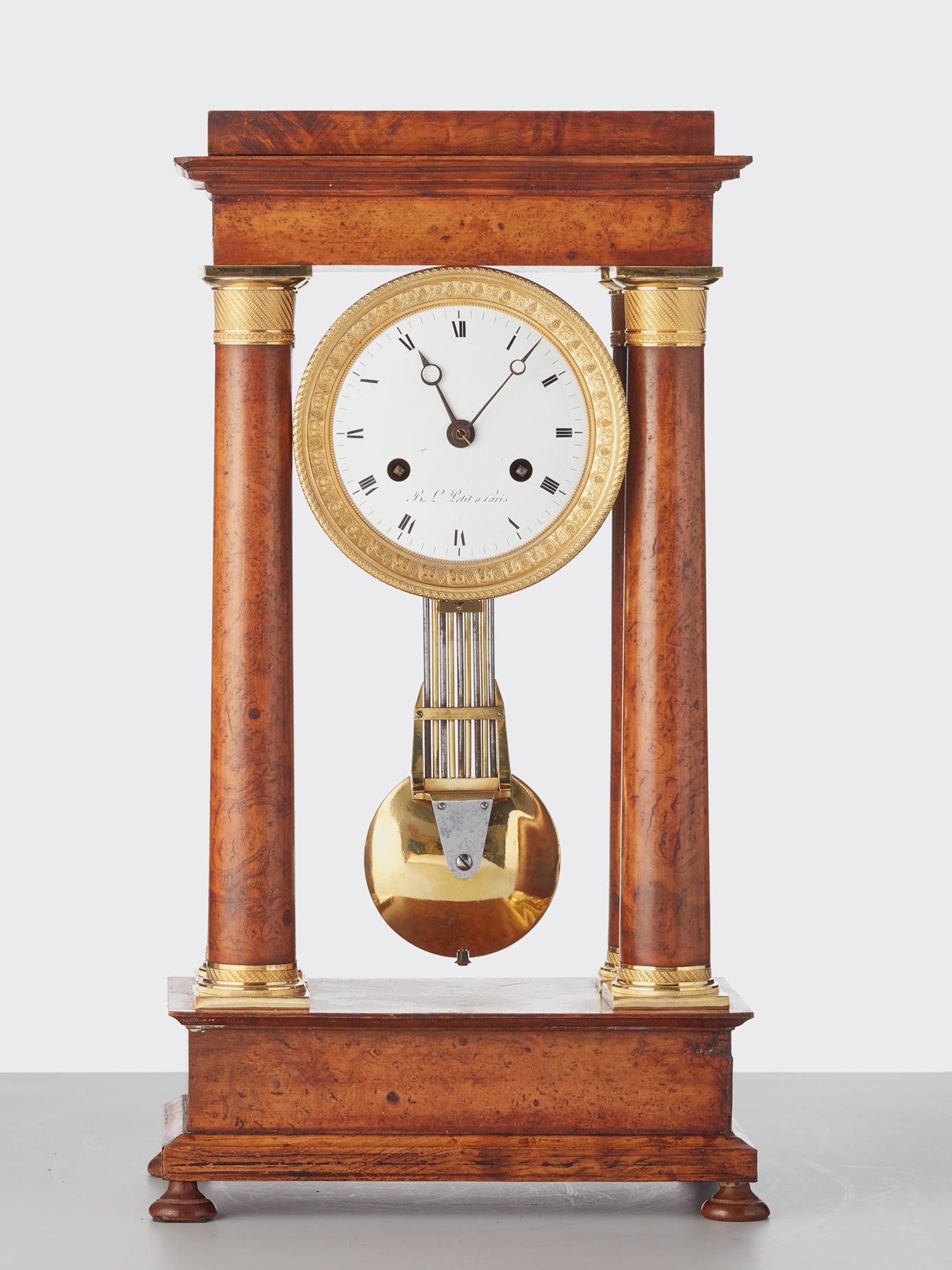 A nice good looking empire maple mantel clock with a so called compensated pendulum.

The striking 8-day movement with countwheel on bell. The nice pendulum on steel spring suspension. Anchor escapement with a grid from steel and bronze with lovely