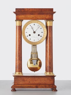 French Empire maple and gilt 4-column clock by B.L. Petit a Paris