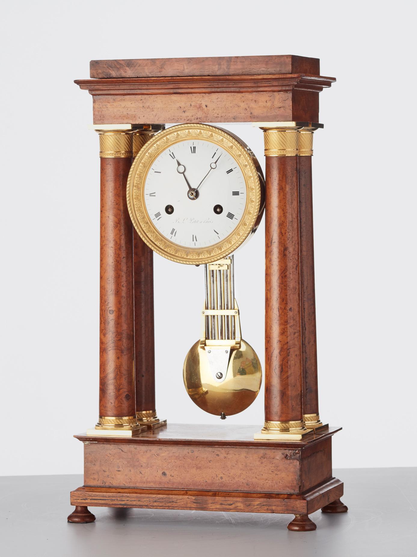 19th Century French Empire maple and gilt 4-column clock by B.L. Petit a Paris For Sale