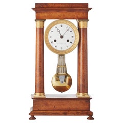 French Empire maple and gilt 4-column clock by B.L. Petit a Paris