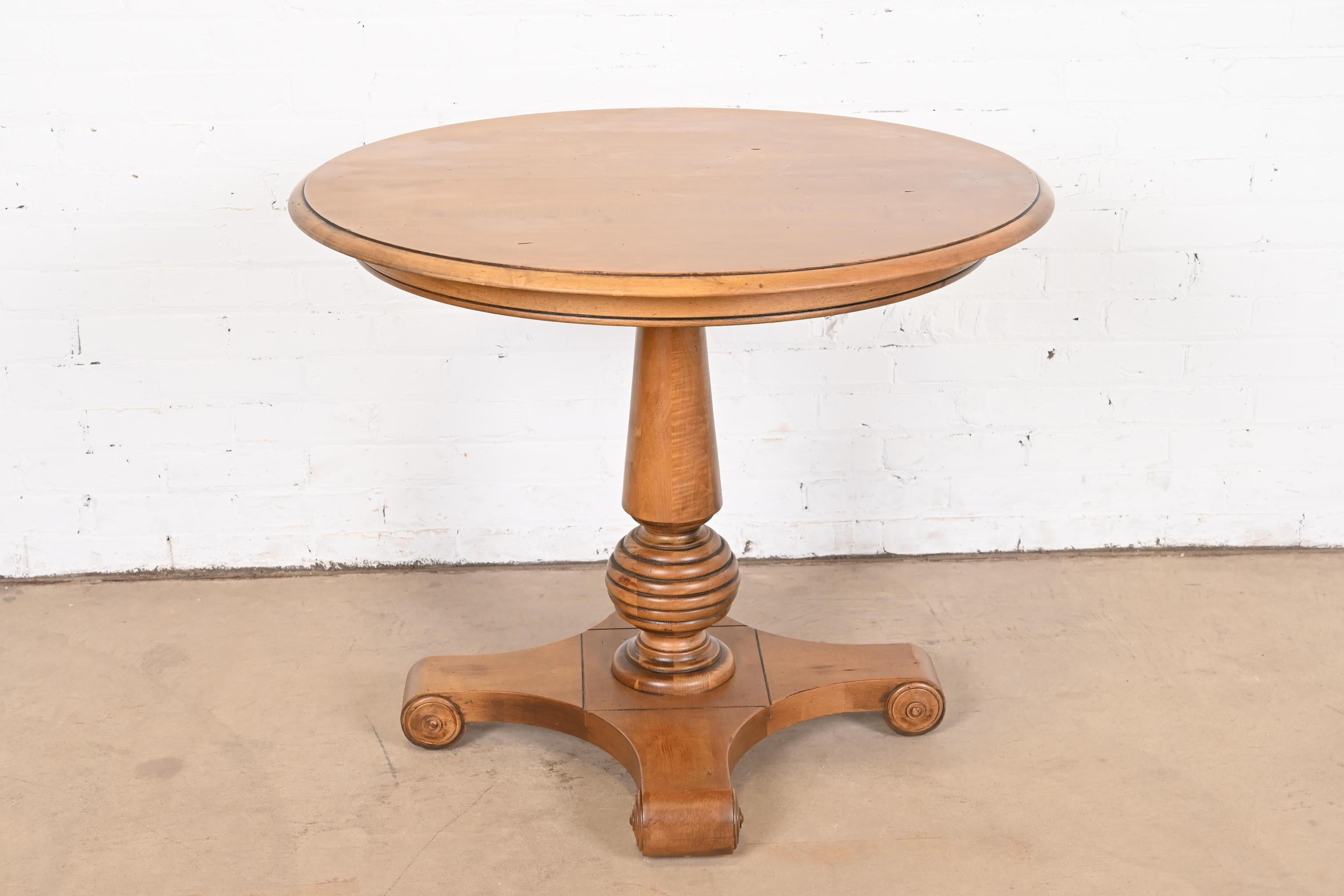 A gorgeous French Empire or French Country style solid maple pedestal breakfast table or center table.

USA, Late 20th Century

Measures: 34.25