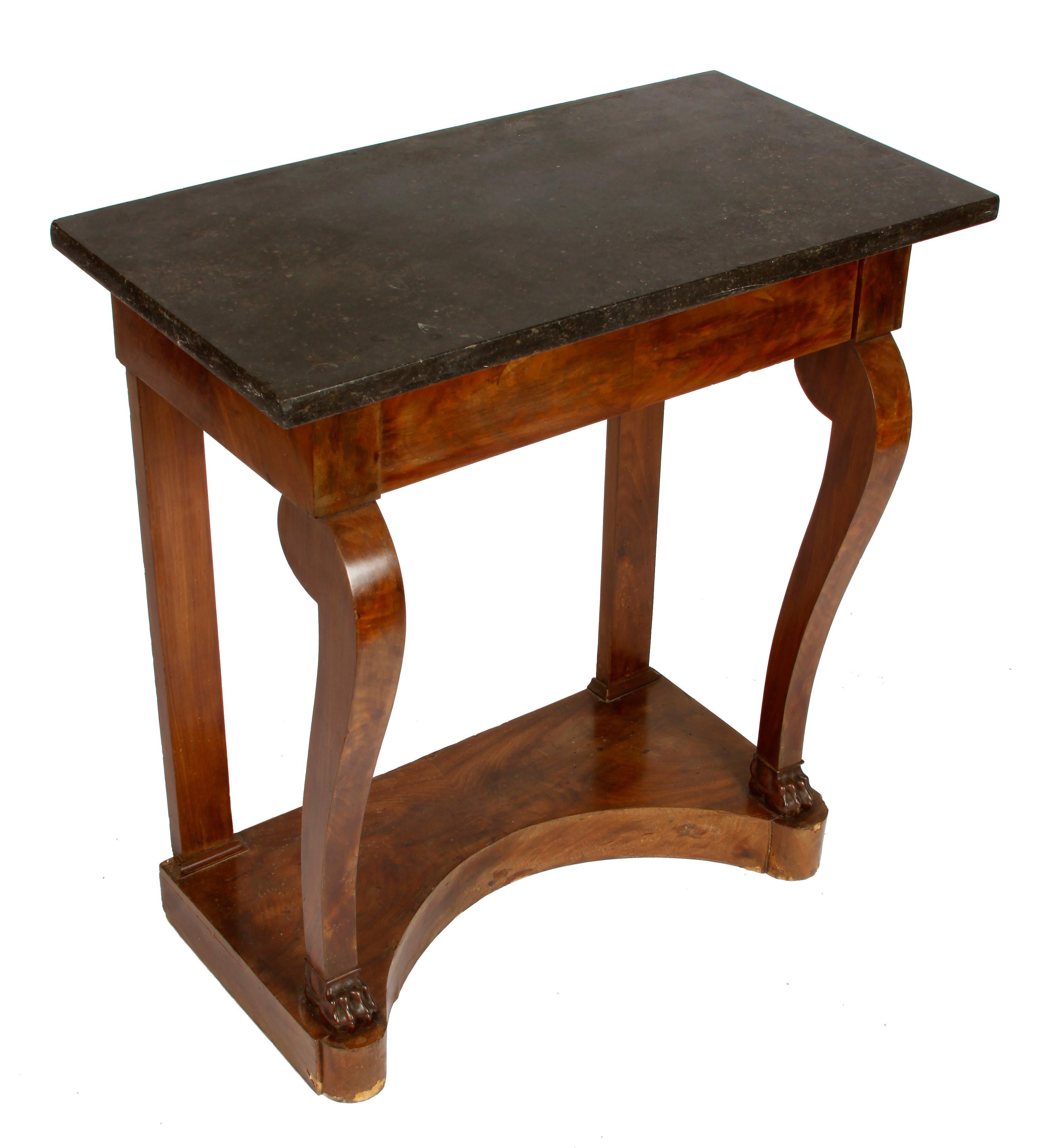 French Empire dark marble top walnut pier table with claw feet.