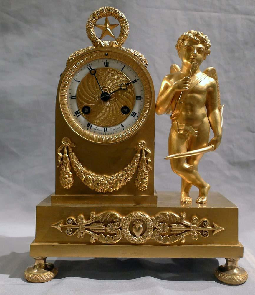 Early 19th Century French Empire Miniature Ormolu Clock of Cupid Signed by Ledure and Thomas For Sale