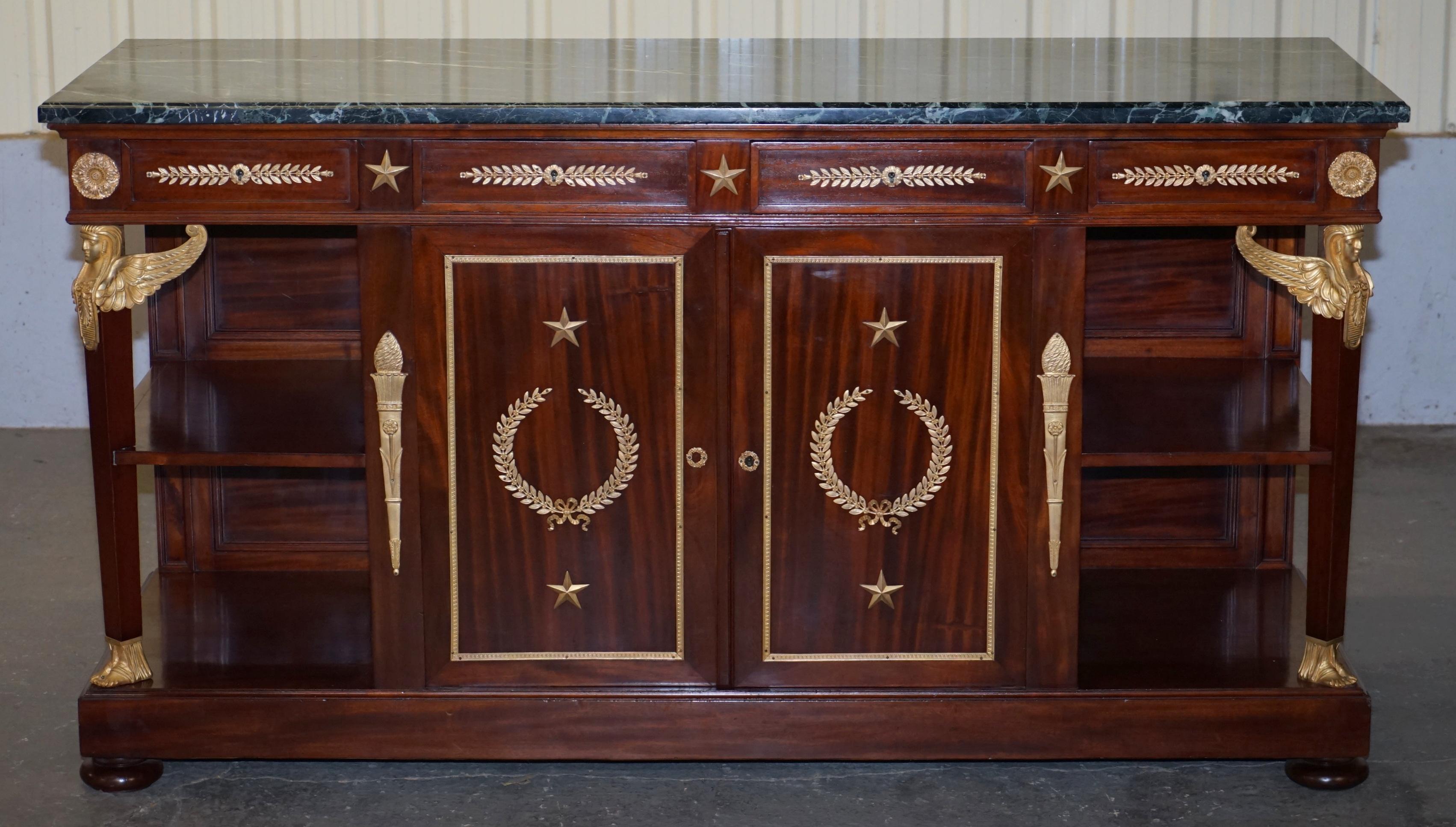 We are delighted to offer for sale this very fine mahogany, gilt bronze marble topped sideboard in the French Napoleon III Empire style

This is exceptional quality, circa 1900, the frame is flamed mahogany, the metal work is gold gilt bronze, its