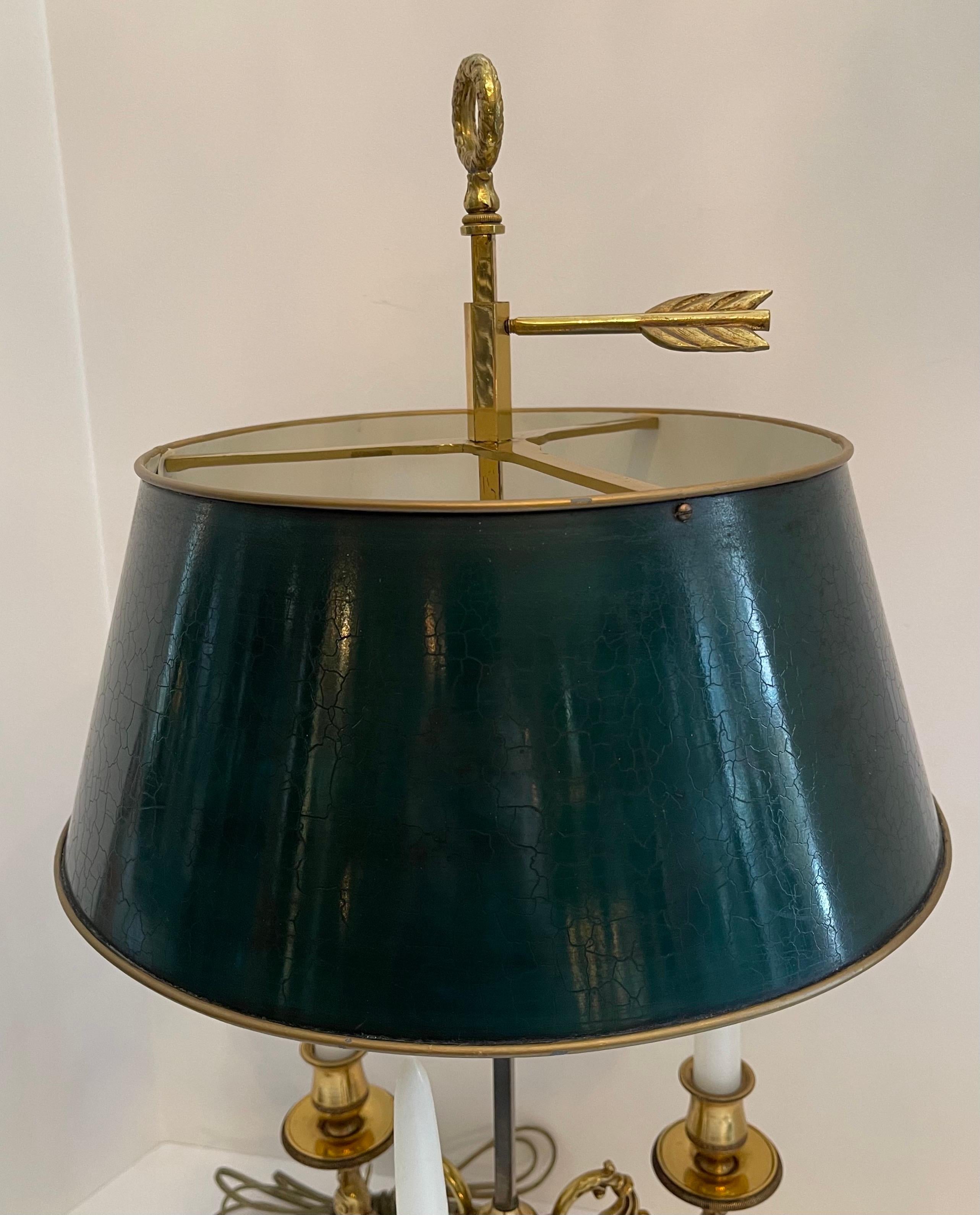 A wonderful French Empire / neoclassical bronze three candelabras Bouillotte lamp with two Edison sockets and dark forest green tole shade.