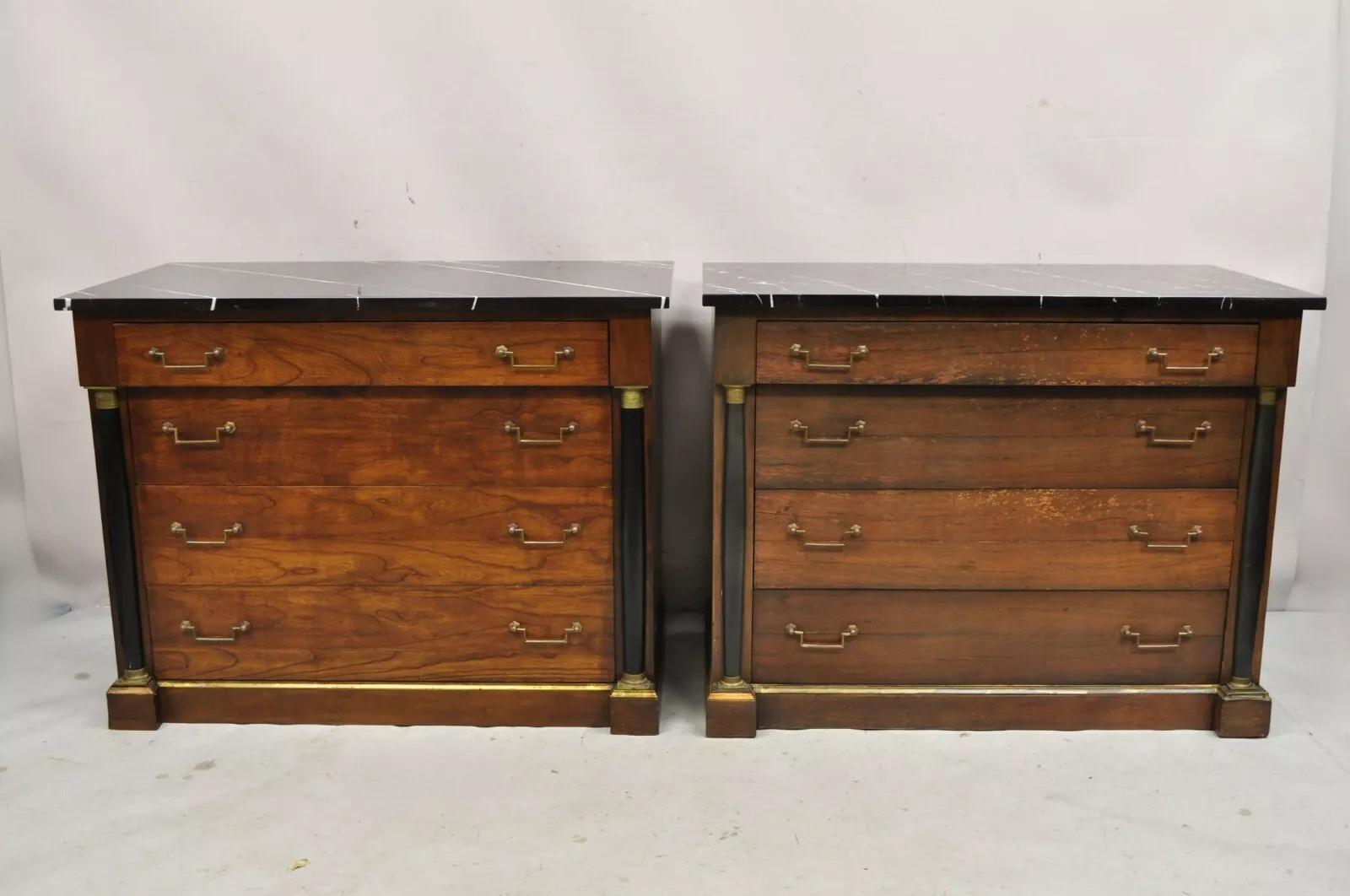 Vintage French Empire Neoclassical Style Marble Top Cherry Wood Commode Chests - a Pair. Made In Italy Exclusively For Bloomingdales. Item features black marble tops with white veins, 4 drawers, brass trim, black column form decorative supports,
