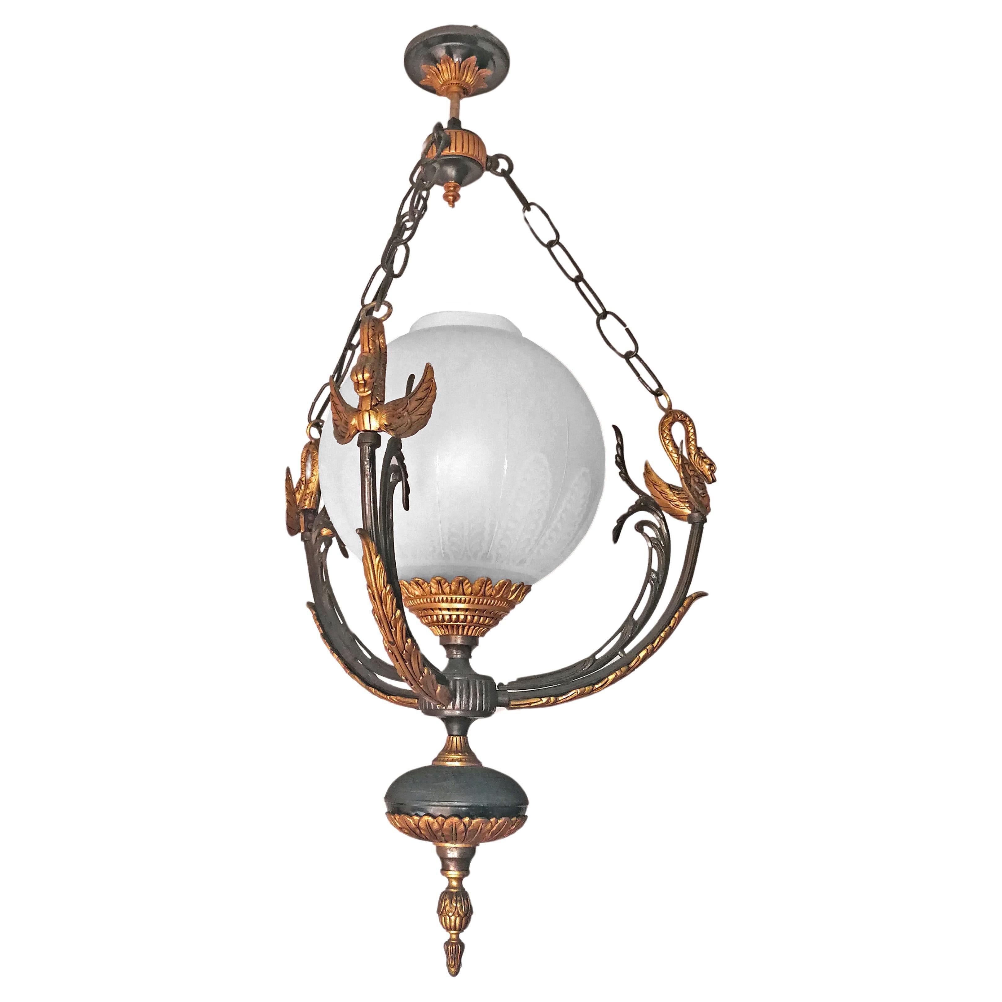 Spectacular French Empire Neoclassical Swan Chandelier in Patinated & Gilded Solid Bronze
Dimensions
Height 33.47 in. (85 cm)
Diameter 19.69 in. (50 cm)
Large Glass shade, 10 in (25 cm)
One porcelain socket E 27/good working condition
Assembly