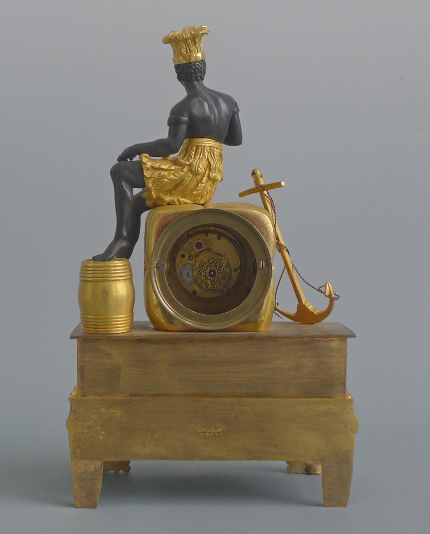 French Empire pendule au bon sauvage mantel clock in ormolu and bronze. The clock is in extremely good condition. Entirely original gilding. A particularly fine convex white enamel dial with Roman numerals. The figure with original white enamel