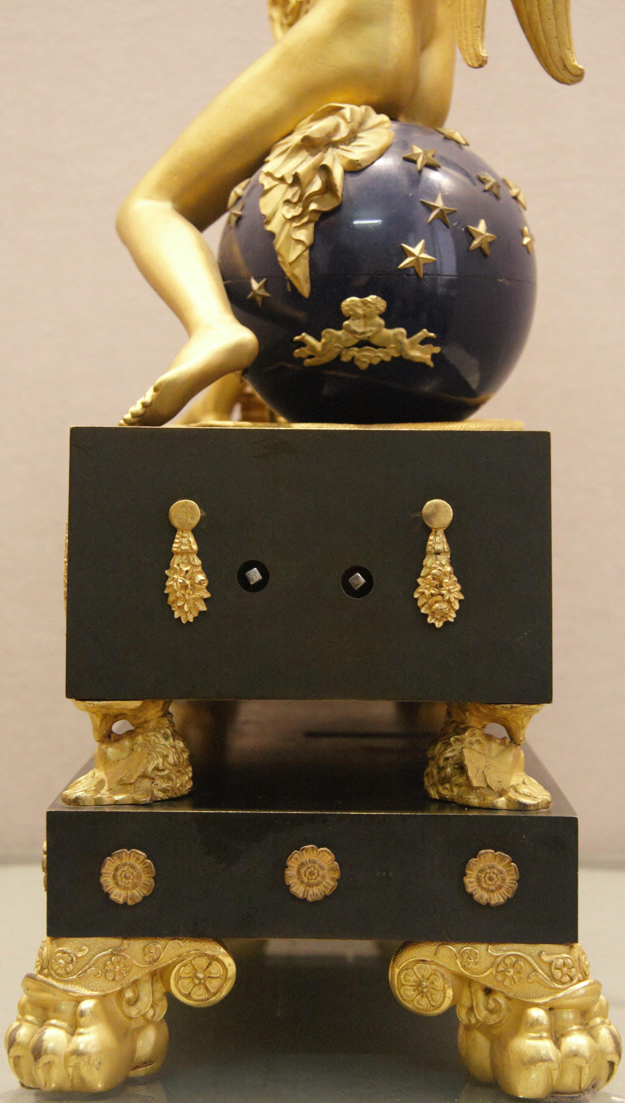 An attractive French Empire ormolu and bronze sculptural 