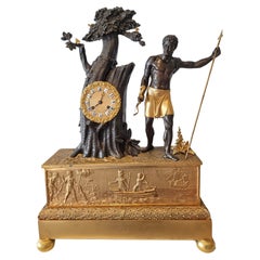 Pendule de cheminée Empire français en bronze patiné et doré