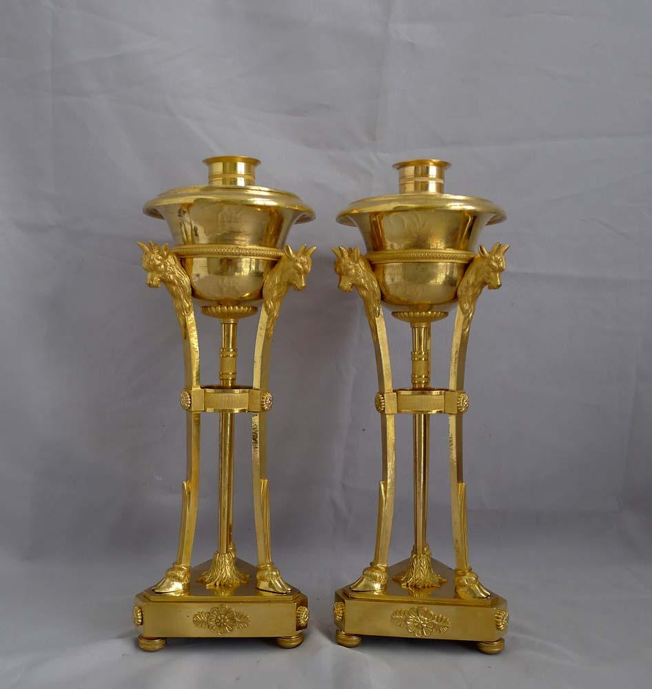 A magnificent pair of French Empire ormolu cassolettes of very fine quality. The cassolettes retain the original fire or mercury gilt ormolu. These cassolettes can be used entirely for decoration as lidded vases or the lids can be turned over and