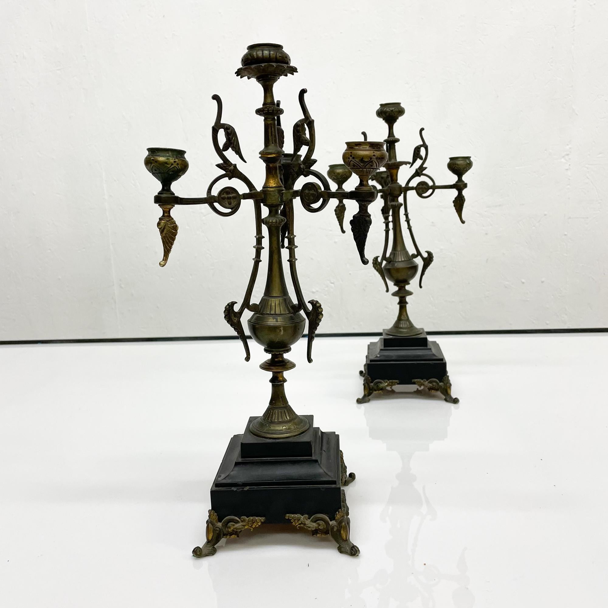 Antique French candelabra four arms candle holder in patinated bronze on black marble, (circa late 1800s). No label. Exceptional quality. Set of 2.
Decorated with graceful stems and foliate branches
In the style of Henri Houdebine and Henry