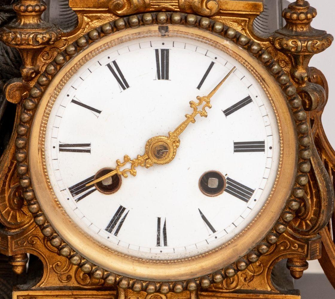 French Empire Patinated & Gilt Metal Figural Clock In Good Condition For Sale In Astoria, NY