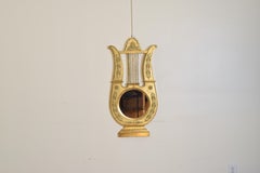 Specchio in legno dorato intagliato del periodo Impero francese, ex barometro, XIX secolo