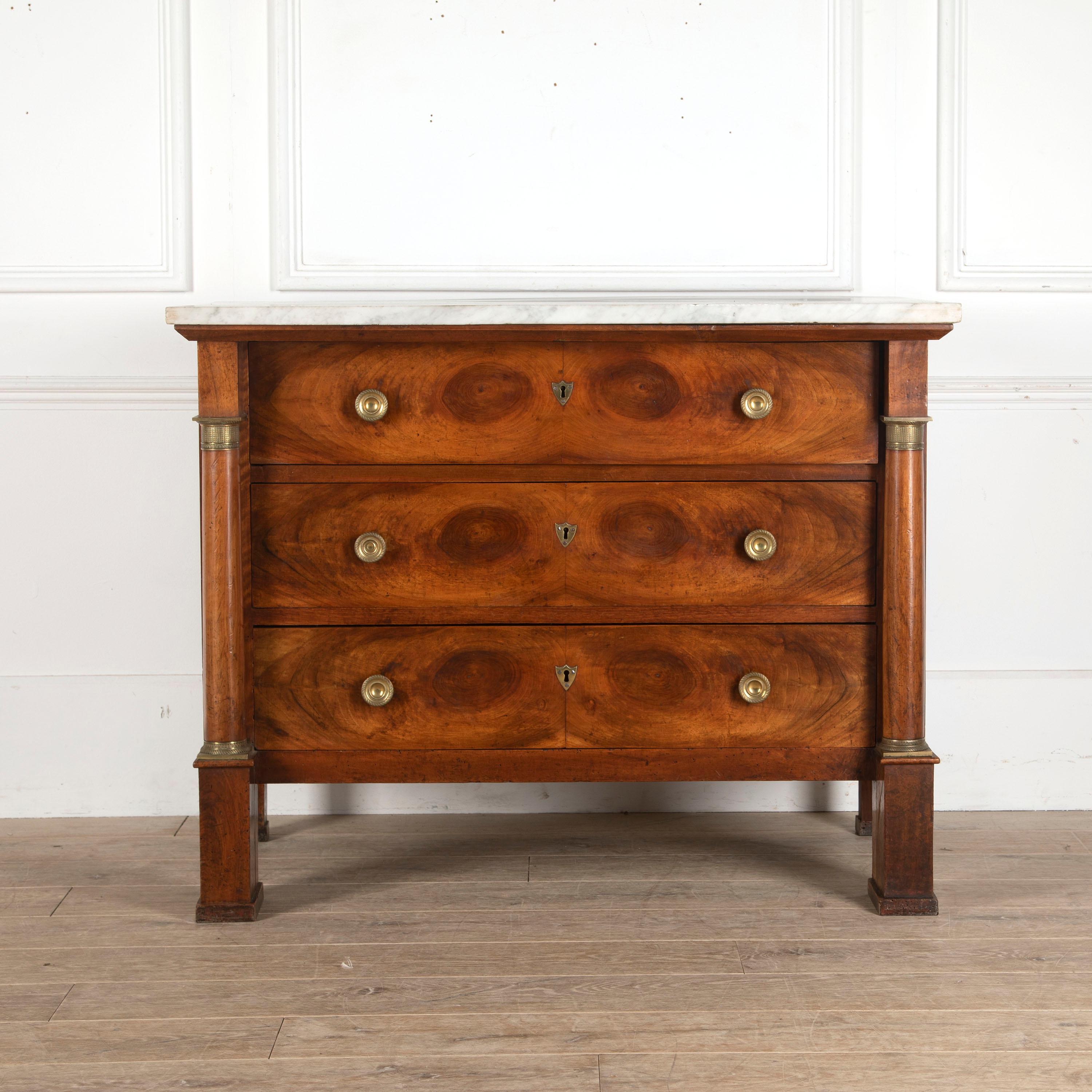 19th century French walnut commode with its original marble top.

This delightful commode embodies the neoclassical style of the Empire. The rectangular body with three drawers is framed by pilasters. 

The three drawers feature beautifully