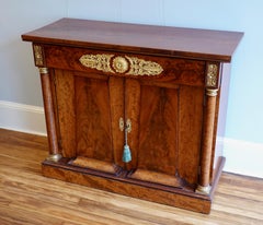 French Empire Period Flame Mahogany and Parcel-Gilt Cabinet