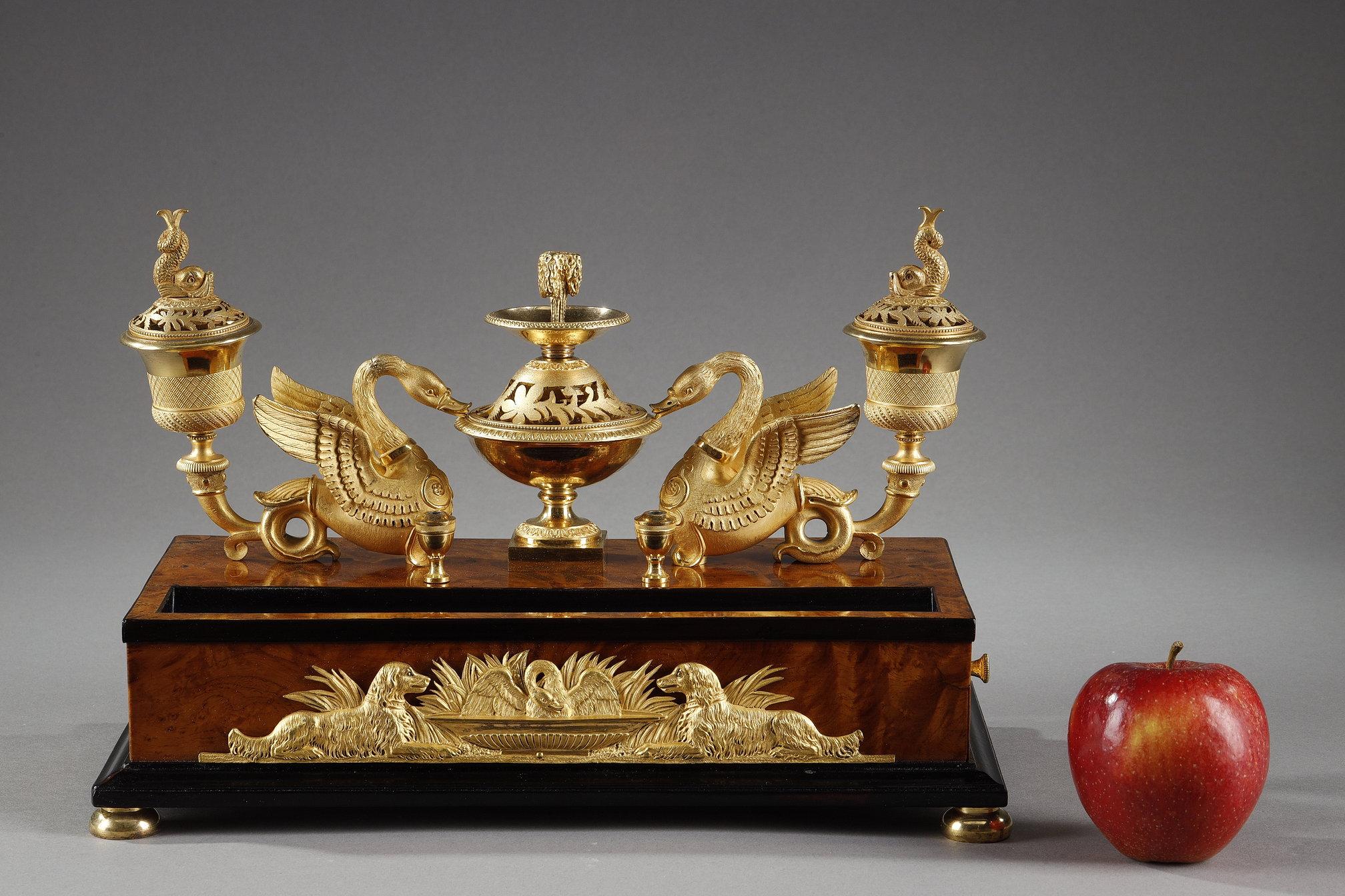 Empire period gilt bronze and bird's eye maple veneer inkwell.

This model is an exact replica of the inkwell that belonged to Elisa Bonaparte, Princess of Lucca and Piombino, sister of Napoleon I, now in the collections of the Museo Napoleonico in