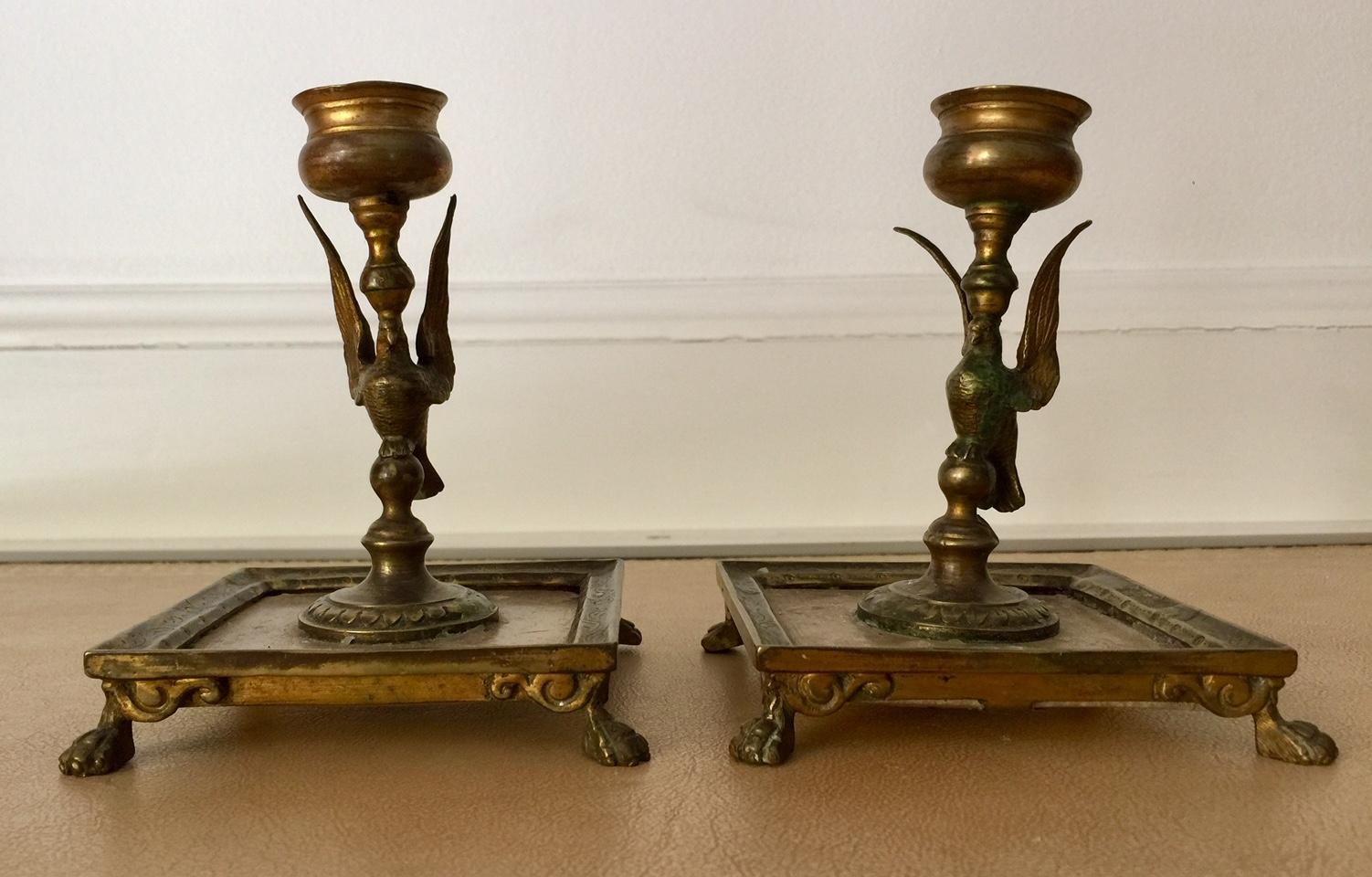 French Emprie Period pair of bronze candleholders, neoclassical
A rare collector quality pair of French First Empire candleholders. A classical bird figure rises from a square alabaster base with a bronze surrond. The design is simple and elegant