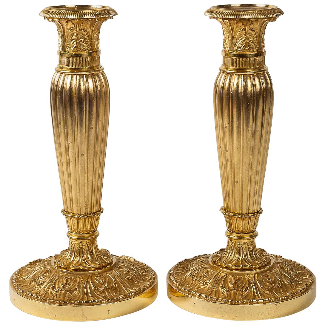French Empire Period, Pair of Chiseled Gilt-Bronze Candlesticks, circa 1805-1810