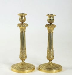 French Empire Period, Pair of Chiseled Ormolu Candlesticks, circa 1805-1810