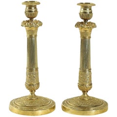 French Empire Period, Pair of Chiseled Ormolu Candlesticks, circa 1805-1810