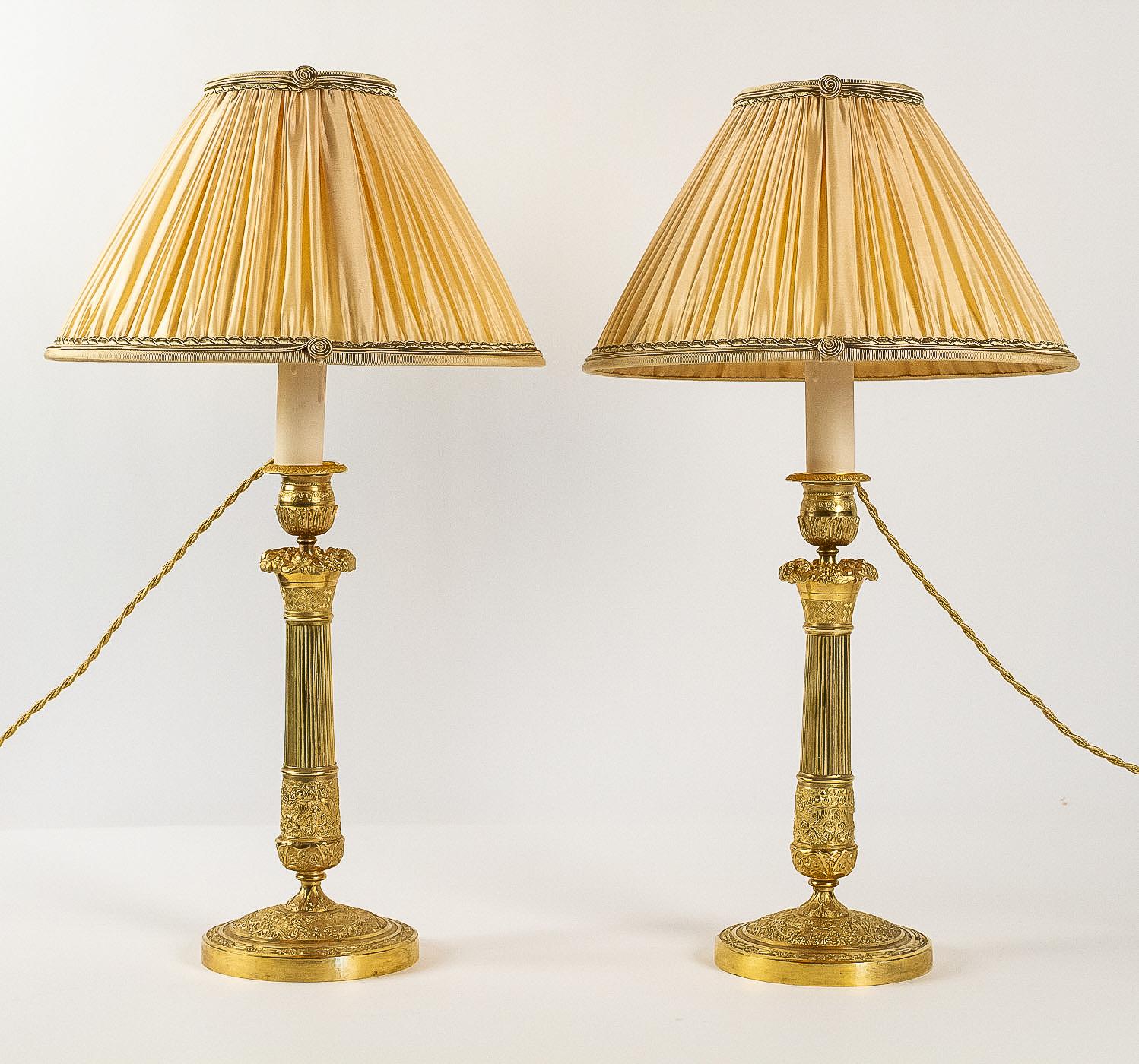 French Empire period, pair of chiseled ormolu candlesticks, converted in table lamps

An exciting and gorgeous pair of French Empire period gilt bronze candlesticks, finely chiseled of vineyard, flowers, palmettes and Horn of plenty.
Our