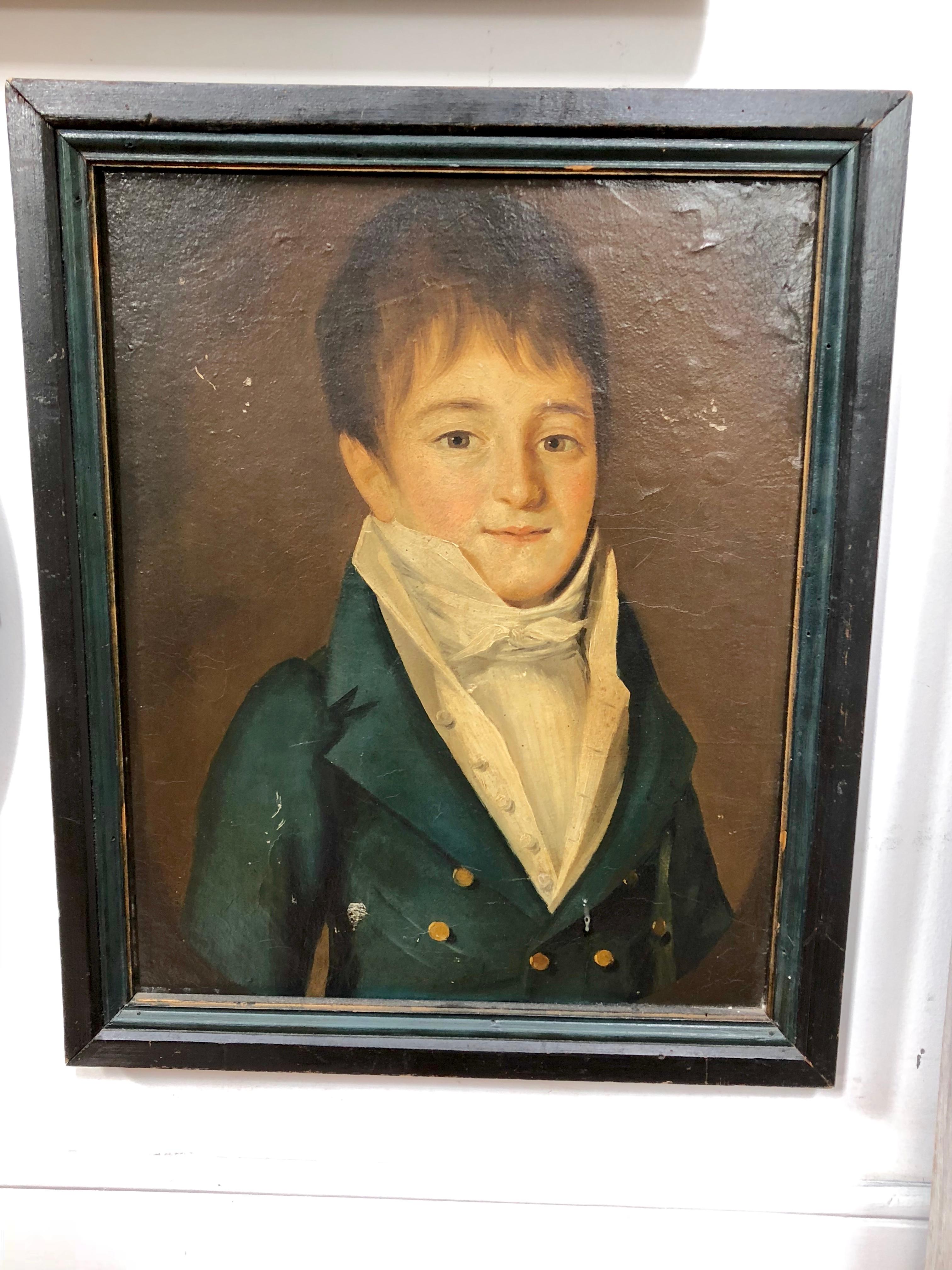 A French Empire period portrait of a young boy, oil on canvas, circa 1800, in original painted frame.