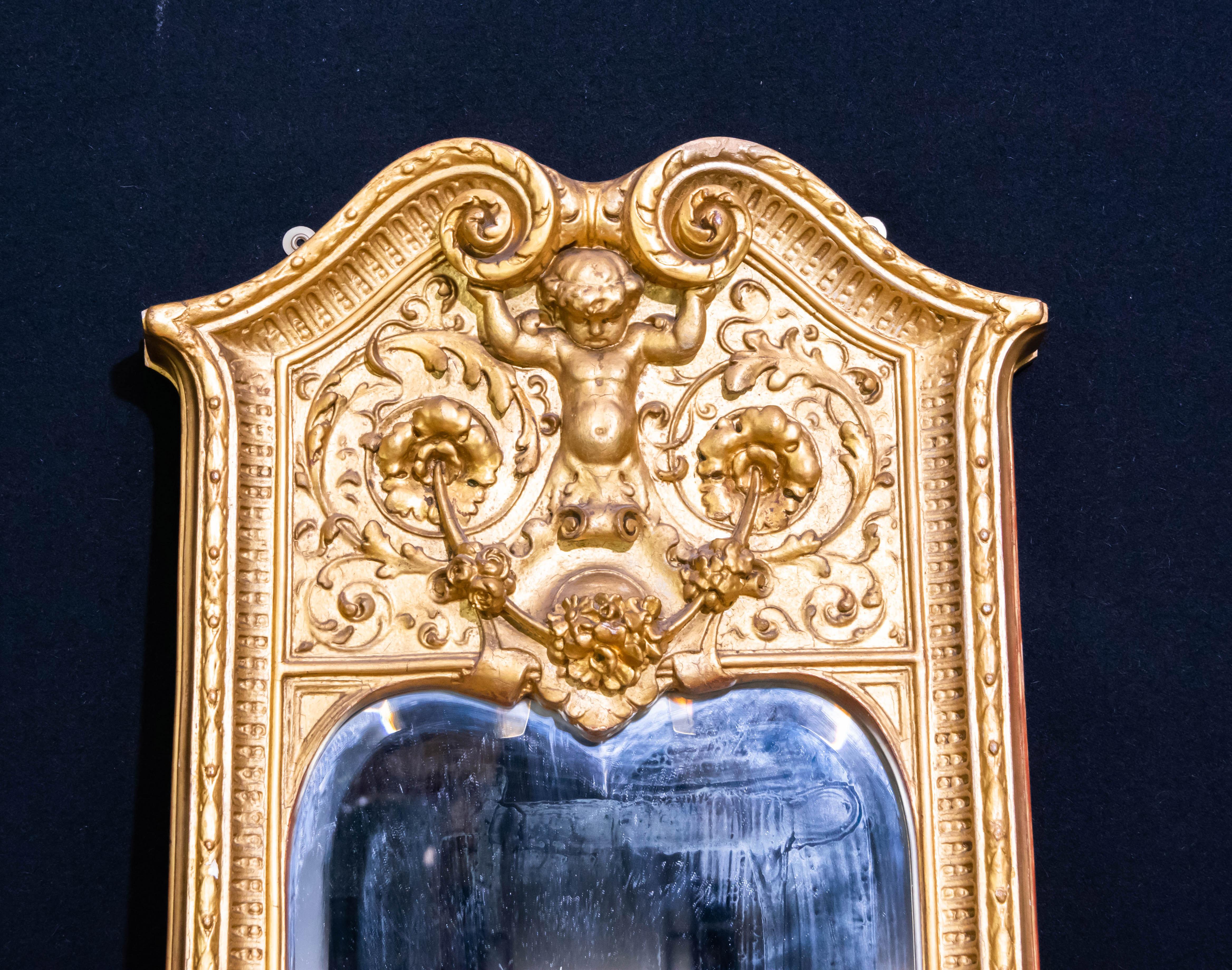 - Gorgeous antique French Empire pier mirror
- Hand carved frame adorned with cherubs
- Offered in great shape ready for home use right away. 

 