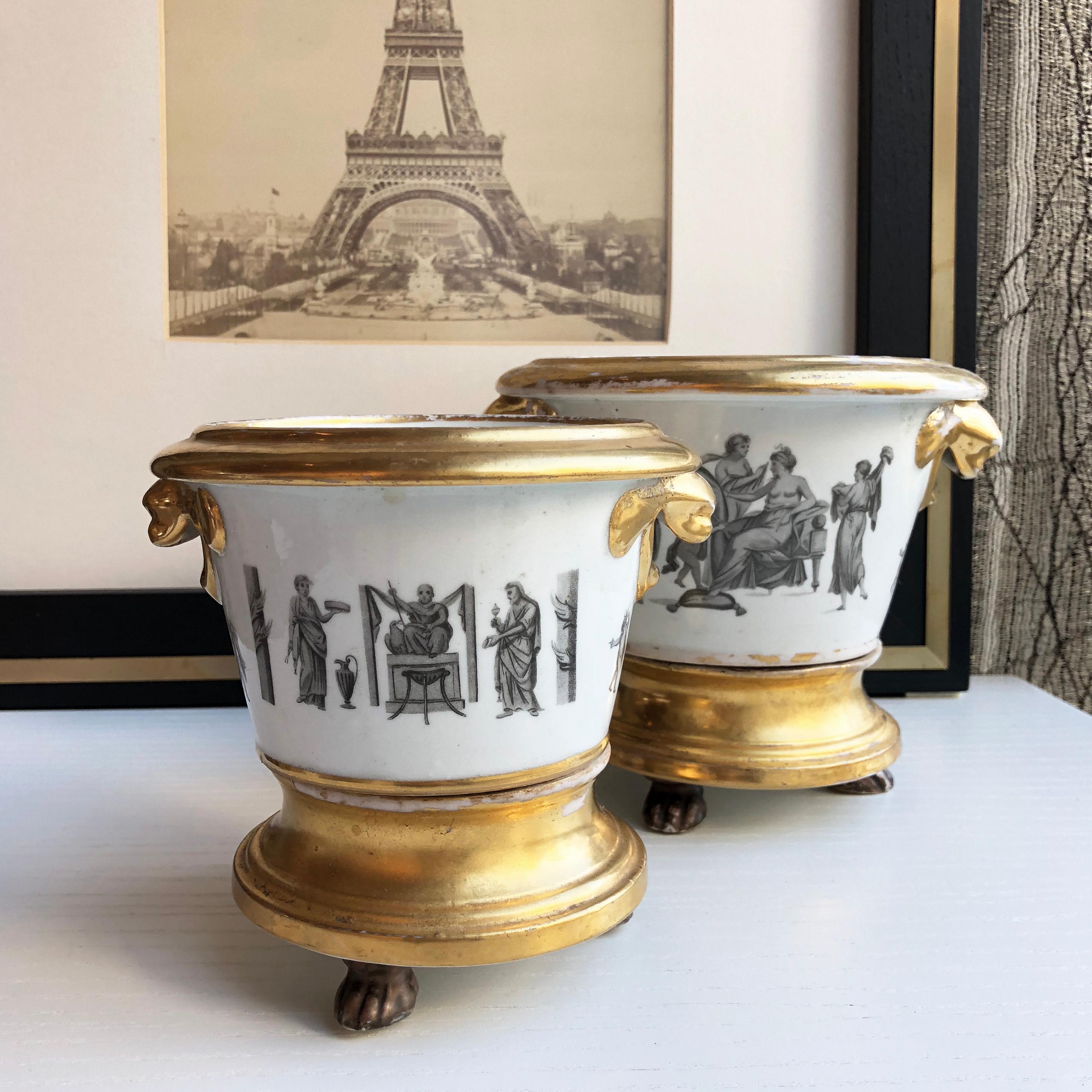 Set of two French planter pots from early 1800’s. Featuring intricate imagery of gods and goddesses, with gold trim. Sold as a set of two.

1 x D18 x H15.5 cm
1 x D14.5 x 13.5 cm

Good antique condition considering the age